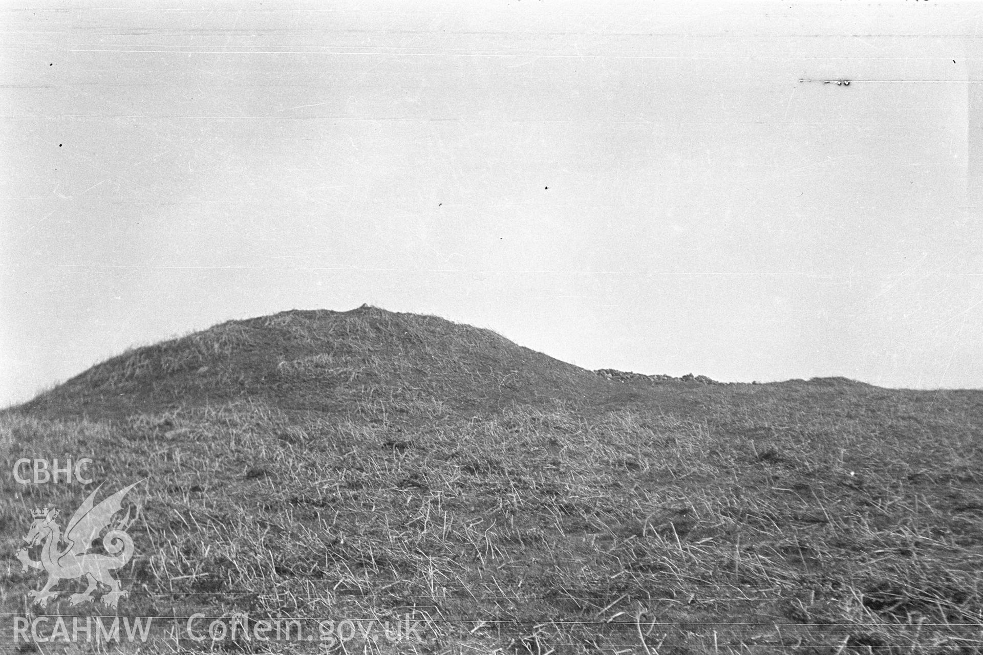 Digital copy of a nitrate negative showing 'Cairns above Cwrt Henllys'.