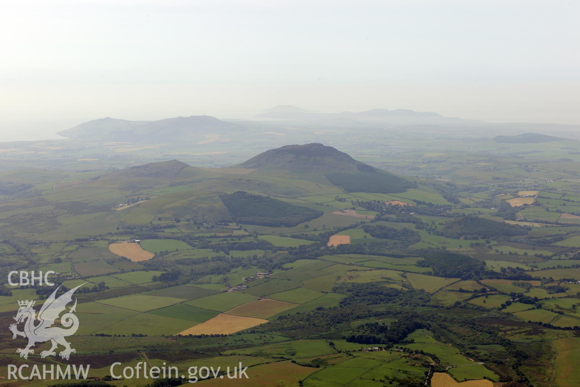 View of Carn Fardyn from the north east. Oblique aerial photograph taken during the Royal Commission?s programme of archaeological aerial reconnaissance by Toby Driver on 12th July 2013.