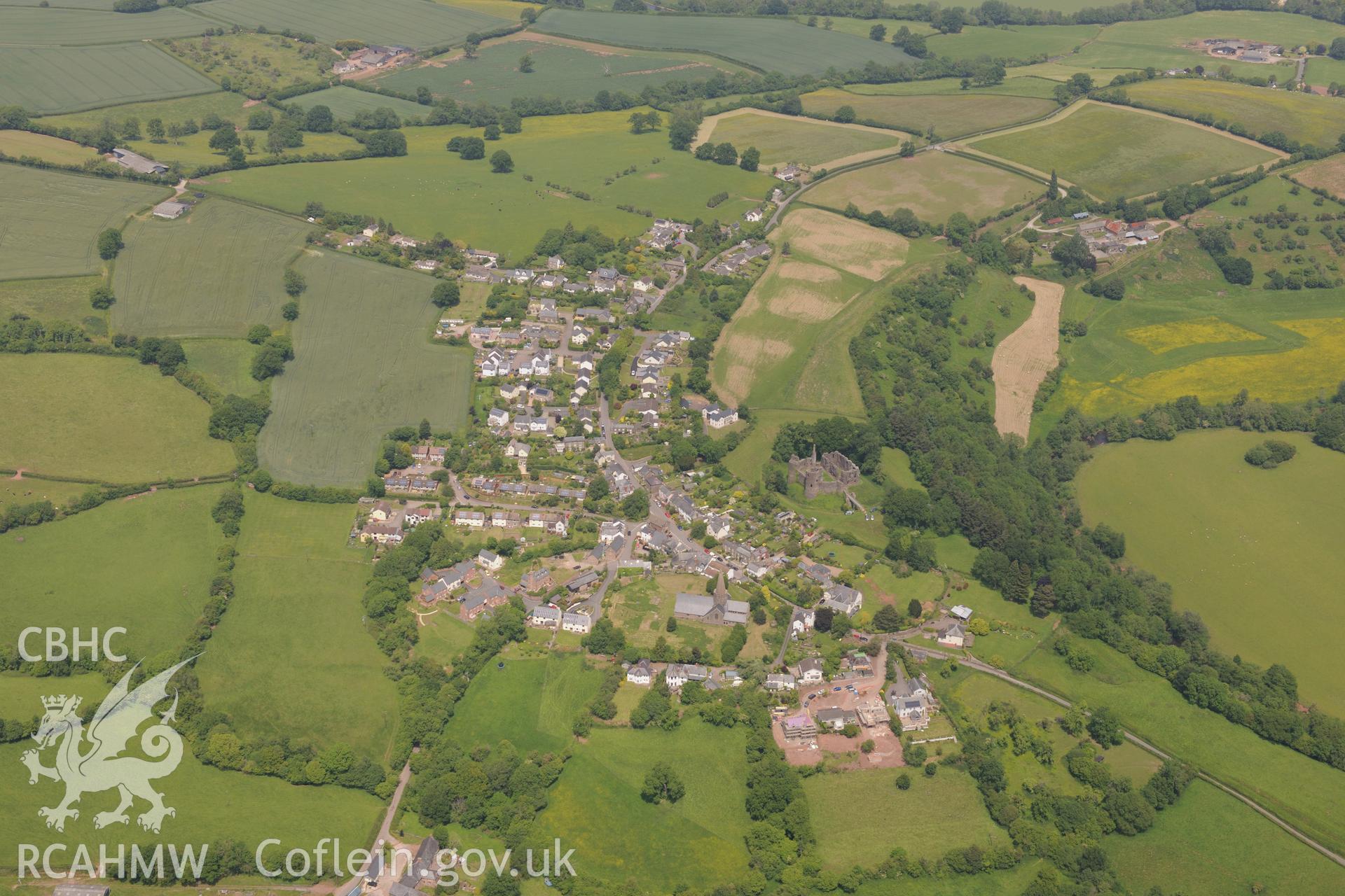 Grosmont village including views of the castle and St. Nicholas' church. Oblique aerial photograph taken during the Royal Commission's programme of archaeological aerial reconnaissance by Toby Driver on 11th June 2015.