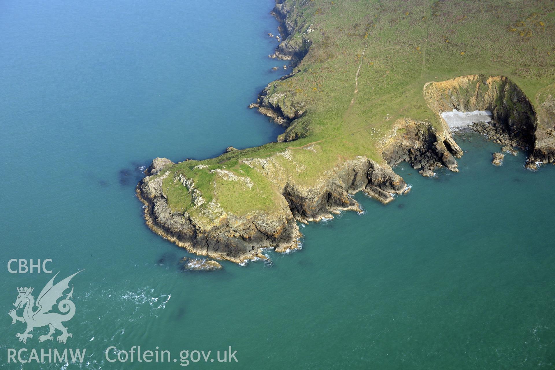 Royal Commission aerial photograph of Wooltack point promontory enclosure taken on 27th March 2017. Baseline aerial reconnaissance survey for the CHERISH Project. ? Crown: CHERISH PROJECT 2017. Produced with EU funds through the Ireland Wales Co-operation Programme 2014-2020. All material made freely available through the Open Government Licence.