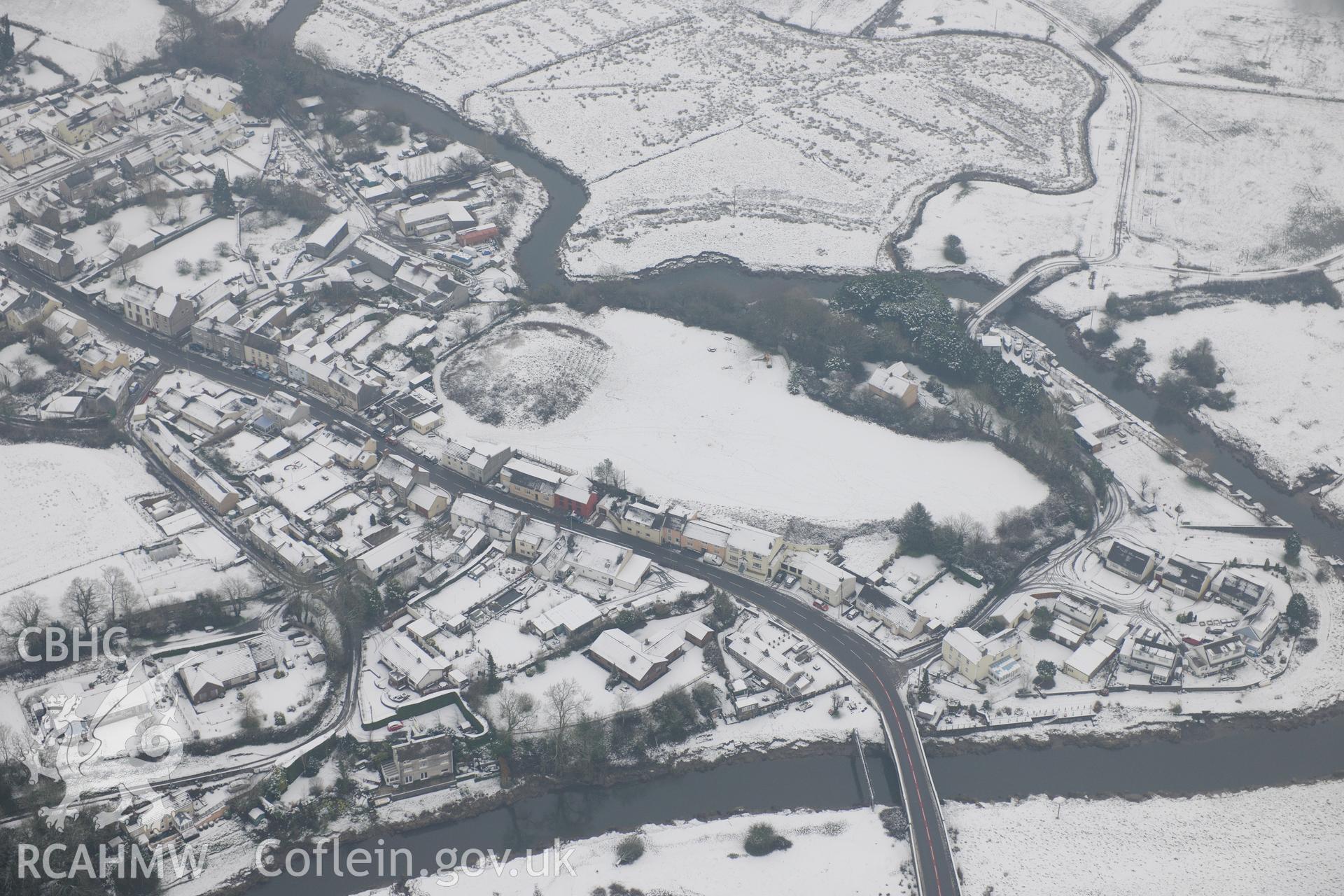 St Clears Castle and Pont St Clears, crossing the river Taff, St Clears. Oblique aerial photograph taken during the Royal Commission?s programme of archaeological aerial reconnaissance by Toby Driver on 24th January 2013.