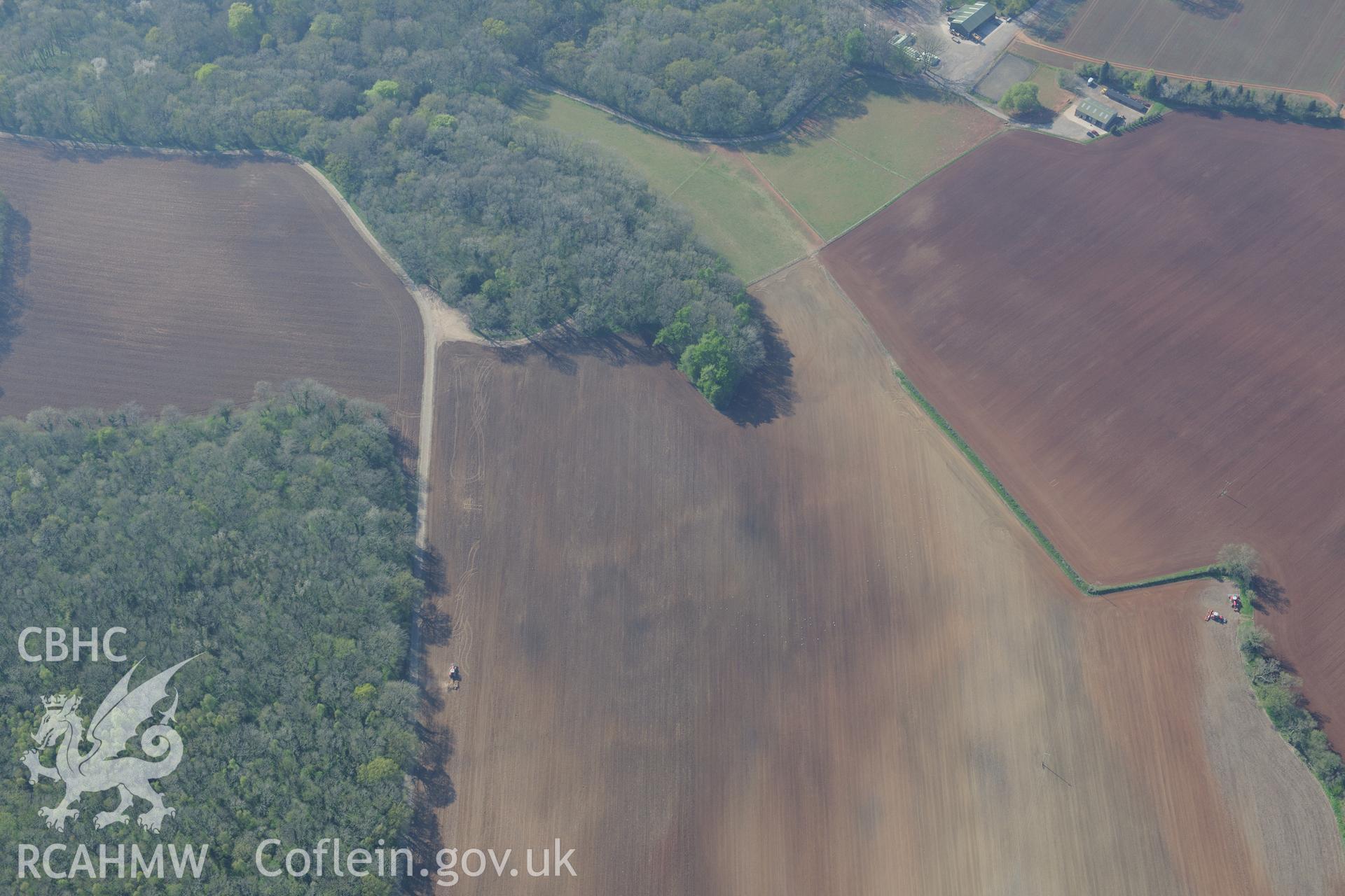 Soilmark enclosures near Nutstalks Wood. Oblique aerial photograph taken during the Royal Commission's programme of archaeological aerial reconnaissance by Toby Driver on 21st April 2015.