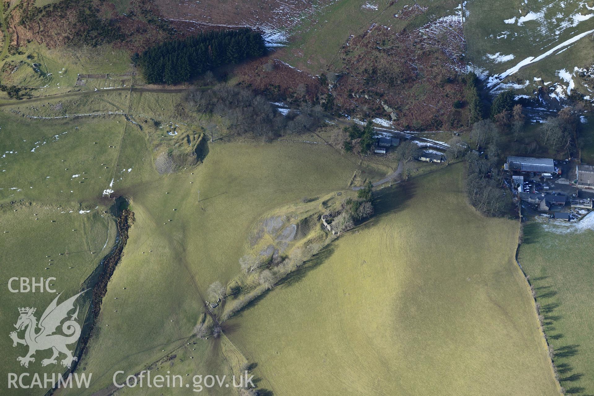 Remains of Bryntail mine at Bryntail Cottage farm, north west of Llanidloes. Oblique aerial photograph taken during the Royal Commission's programme of archaeological aerial reconnaissance by Toby Driver on 4th February 2015.