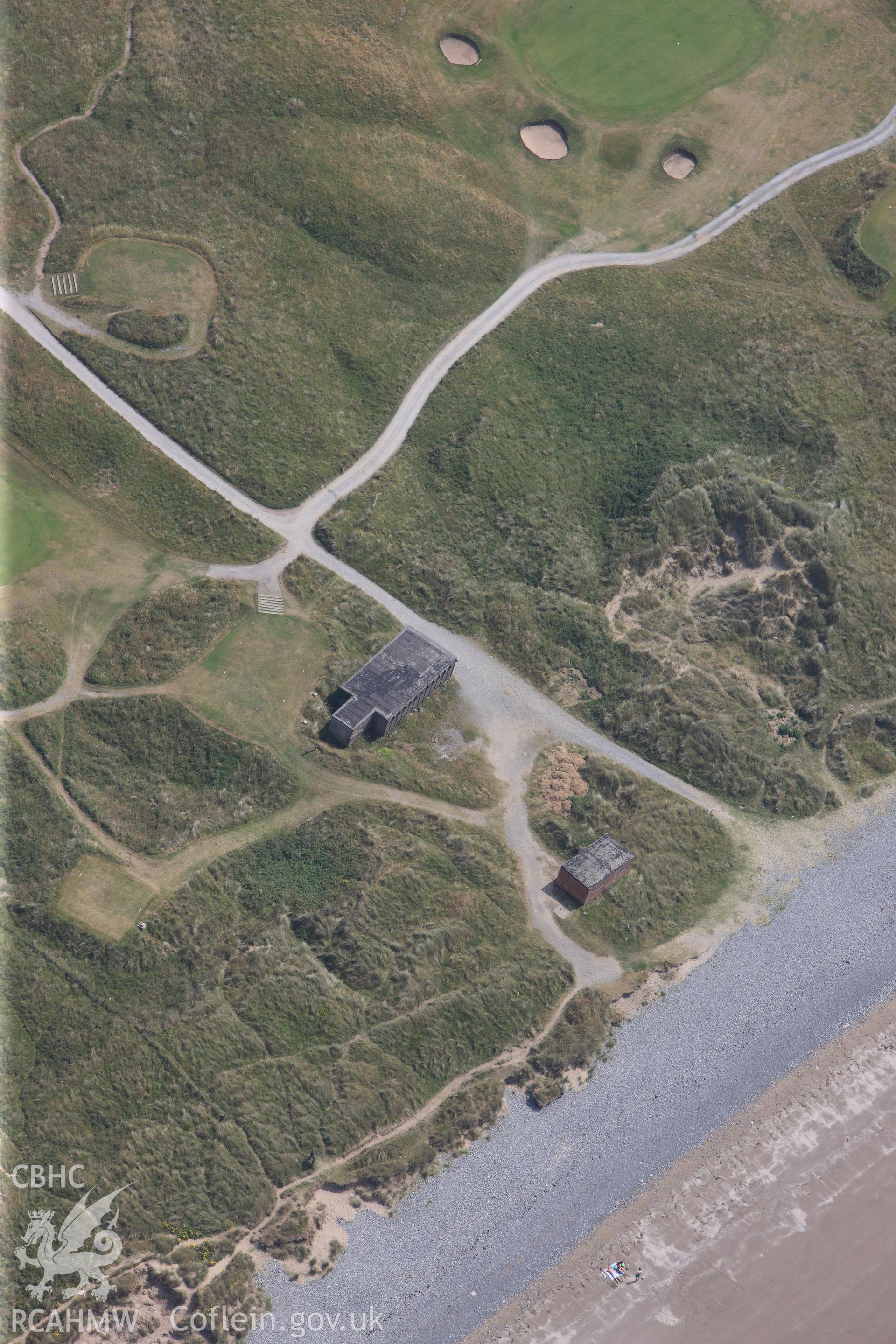 Mos EE AA Ynyslas, Extended BCF hut and radar station. Oblique aerial photograph taken during the Royal Commission?s programme of archaeological aerial reconnaissance by Toby Driver on 12th July 2013.