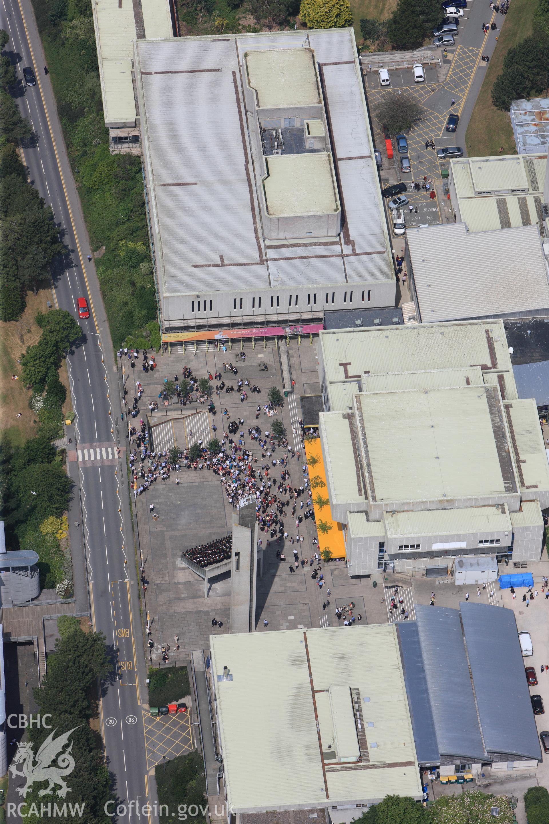 Aberystwyth Arts Centre on Graduation Day. Oblique aerial photograph taken during the Royal Commission?s programme of archaeological aerial reconnaissance by Toby Driver on  12th July 2013.