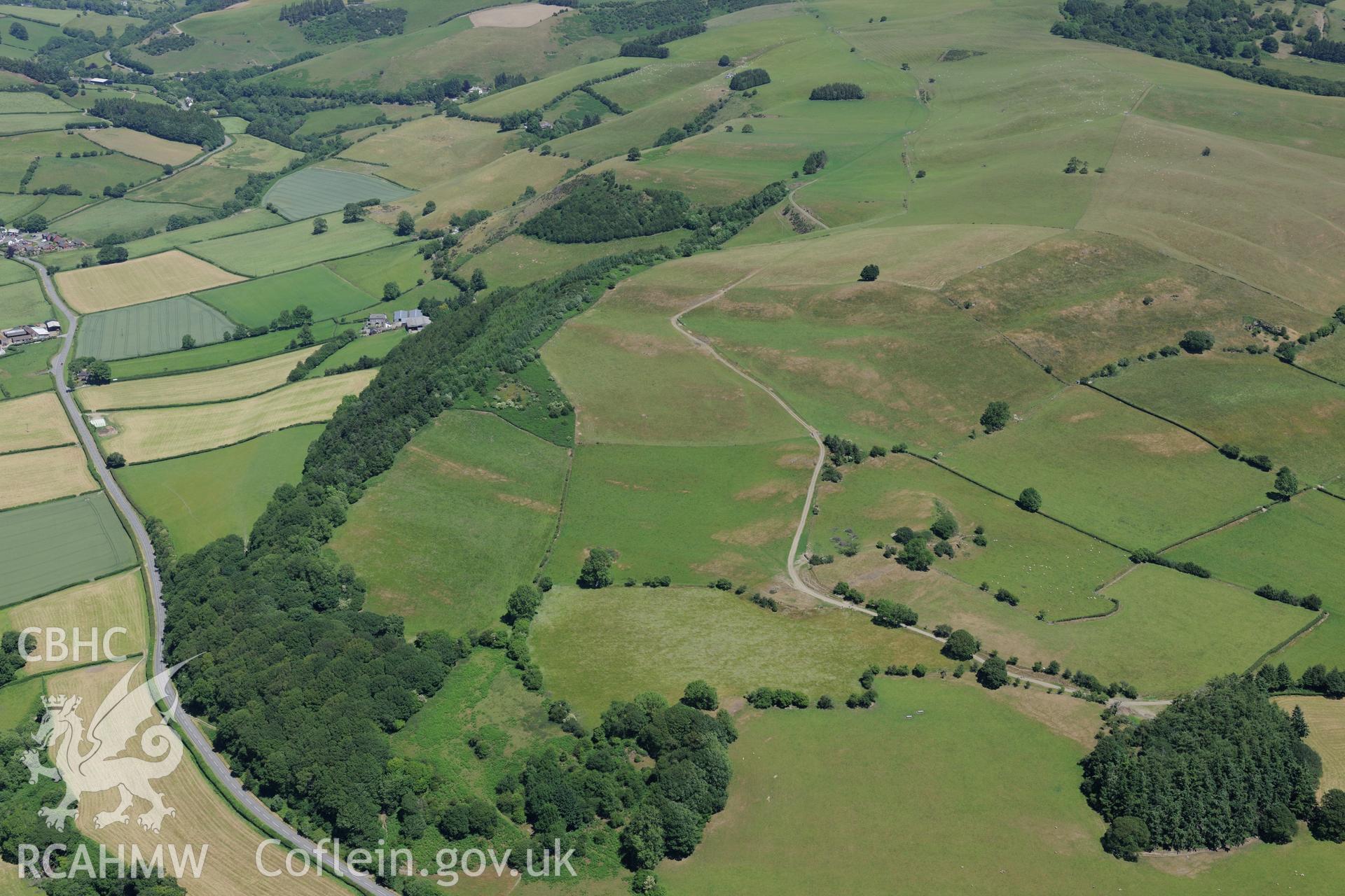 Section of Offa's Dyke 1125 metres south west to Gilfach Wood, north east of Presteigne. Oblique aerial photograph taken during the Royal Commission's programme of archaeological aerial reconnaissance by Toby Driver on 30th June 2015.