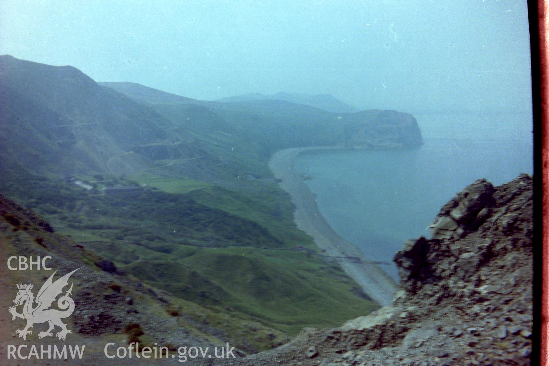 Digitised colour photograph with Porth-y-Nant village and stone quarry in the distance. Produced during a Bachelor of Architecture dissertation: 'The Form & Architecture of Nineteenth Century Industrial Settlements in Rural Wales' by Martin Davies, 1979.