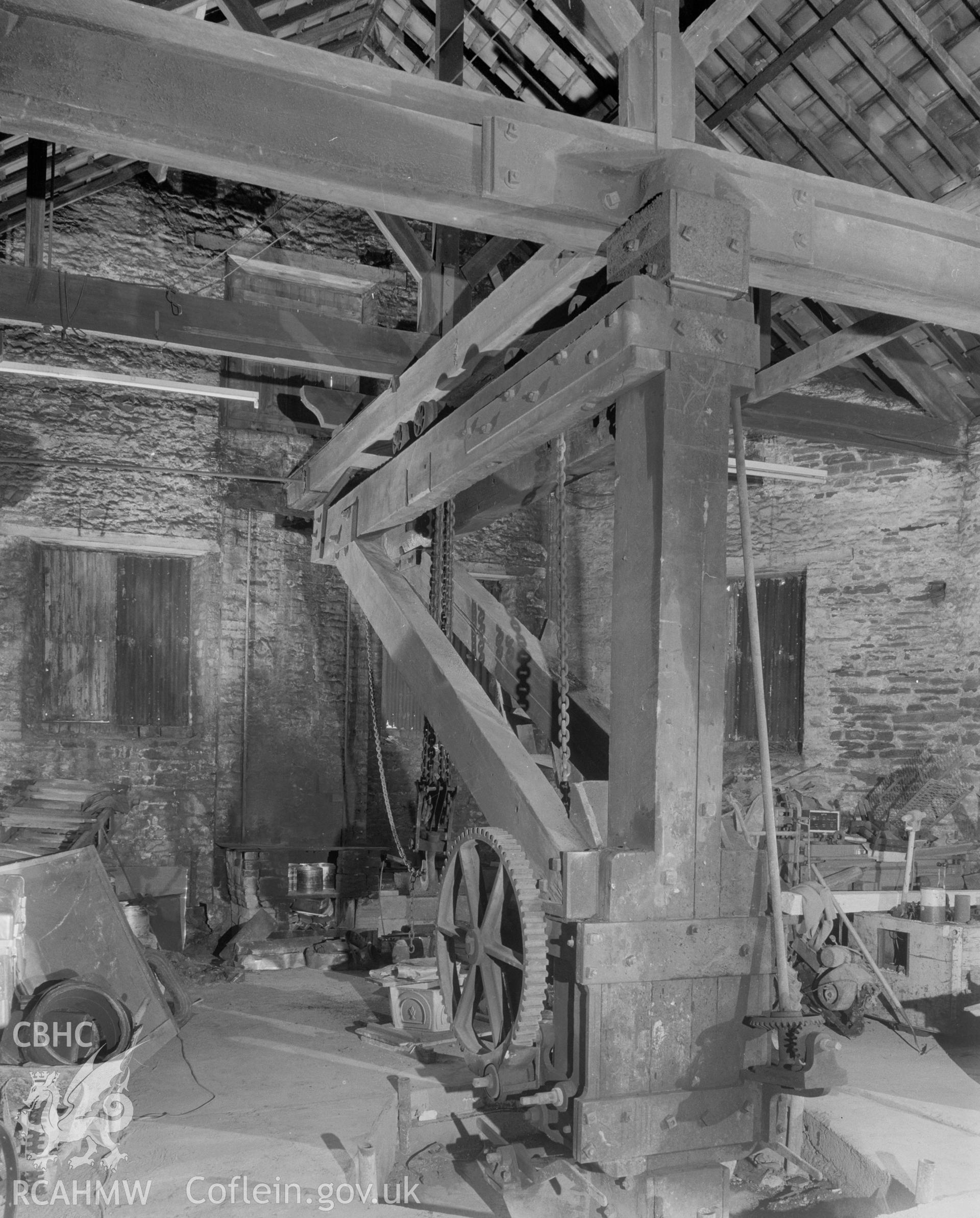 Digital copy of a black and white negative showing detail of the crane at Player's Works Foundry, Clydach, taken by RCAHMW, undated.