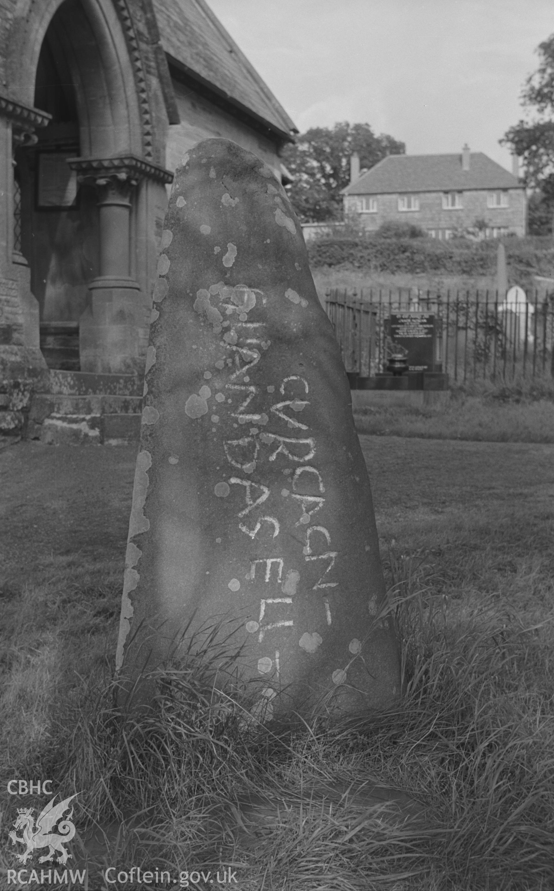 Digital copy of a black and white negative showing Roman stone at St. Llawddog's church, Cenarth. Photographed in September 1963 by Arthur O. Chater.