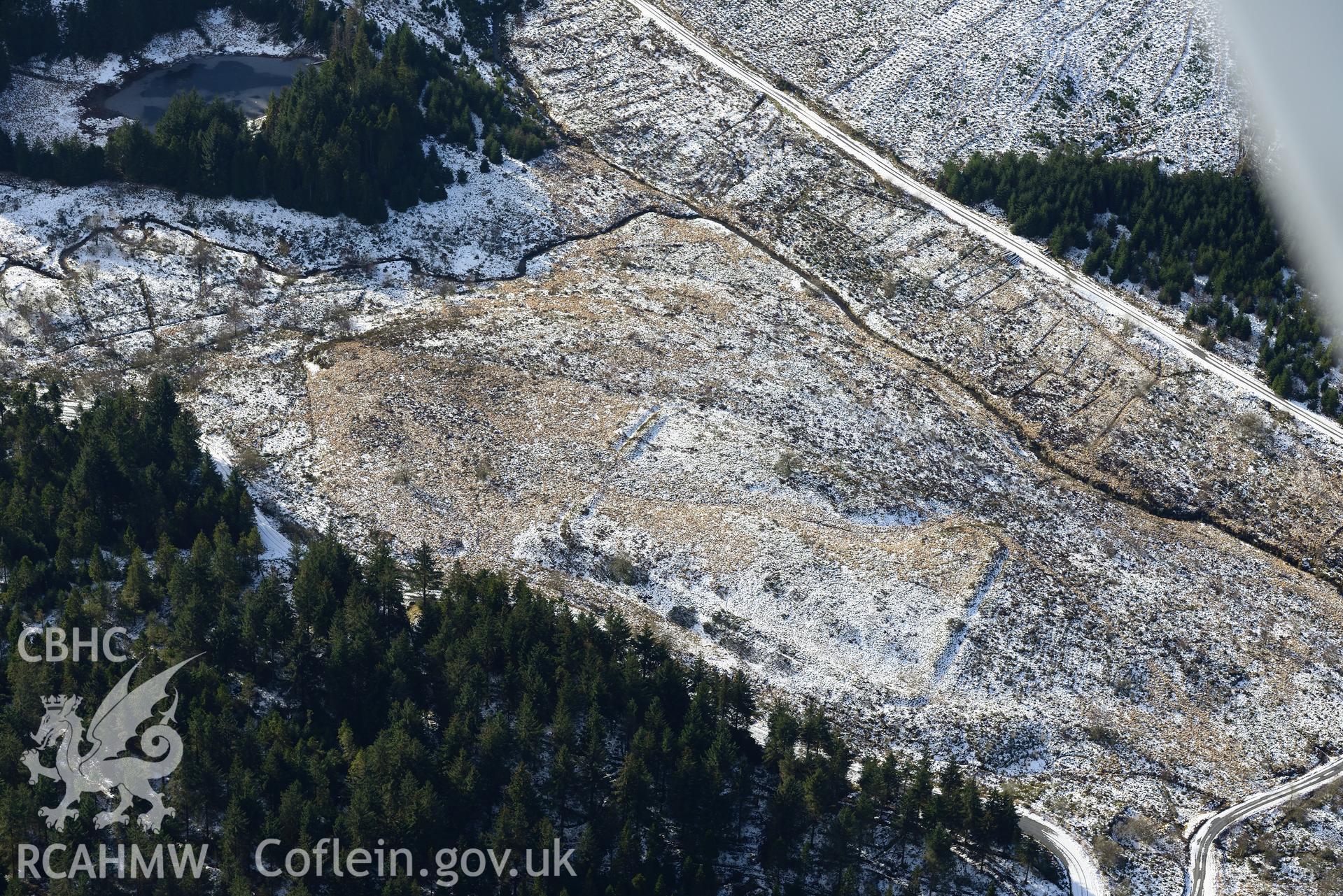 Cae Gaer roman fort, also known as Gorsedd Arthur, west of Llangurig. Oblique aerial photograph taken during the Royal Commission's programme of archaeological aerial reconnaissance by Toby Driver on 4th February 2015.