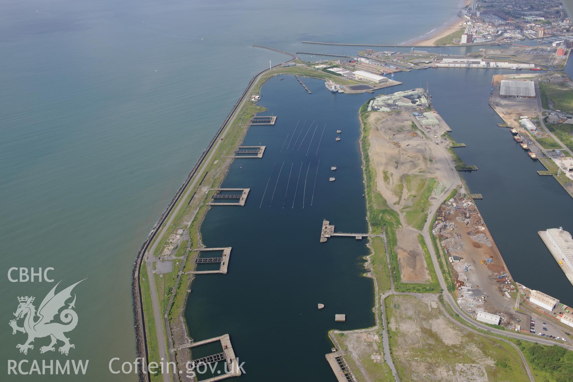 Workshops around the King's and Queen's docks at Swansea Docks. Oblique aerial photograph taken during the Royal Commission's programme of archaeological aerial reconnaissance by Toby Driver on 19th June 2015.