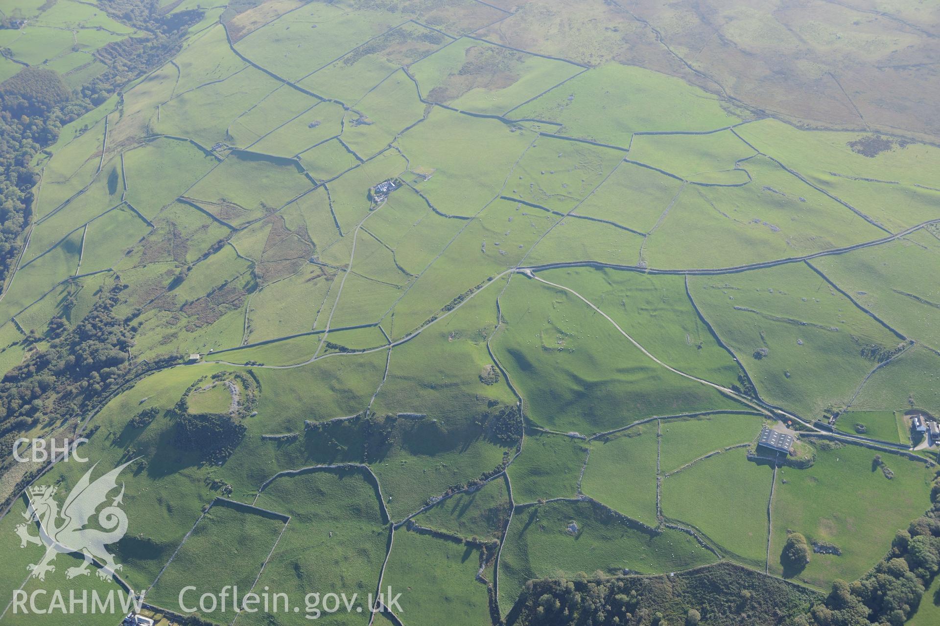 Castell y Gaer, the field system to the west of the Castell, and an enclosure north east of Carn-Gadell Uchaf. Oblique aerial photograph taken during the Royal Commission's programme of archaeological aerial reconnaissance by Toby Driver on 2nd October 2015.