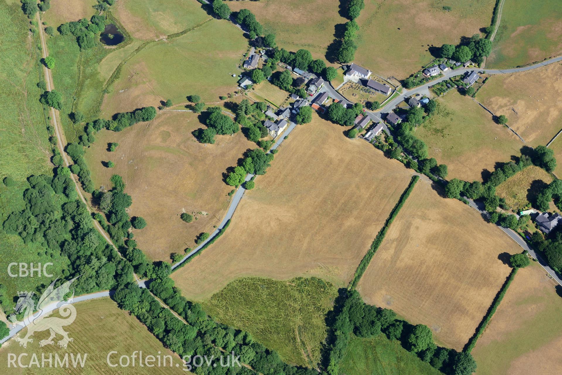 Royal Commission aerial photography of Ystradmeurig village taken on 19th July 2018 during the 2018 drought.