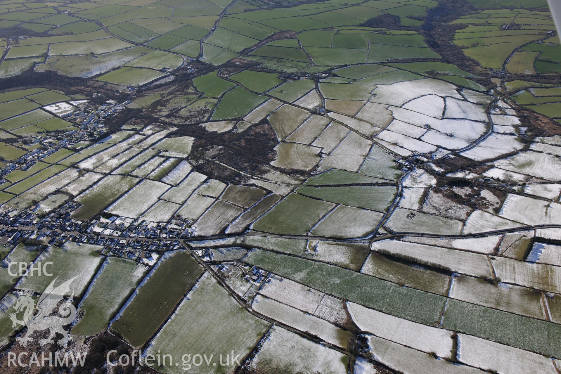 View of the village of Maenclochog from the east. Oblique aerial photograph taken during the Royal Commission's programme of archaeological aerial reconnaissance by Toby Driver on 4th February 2015.