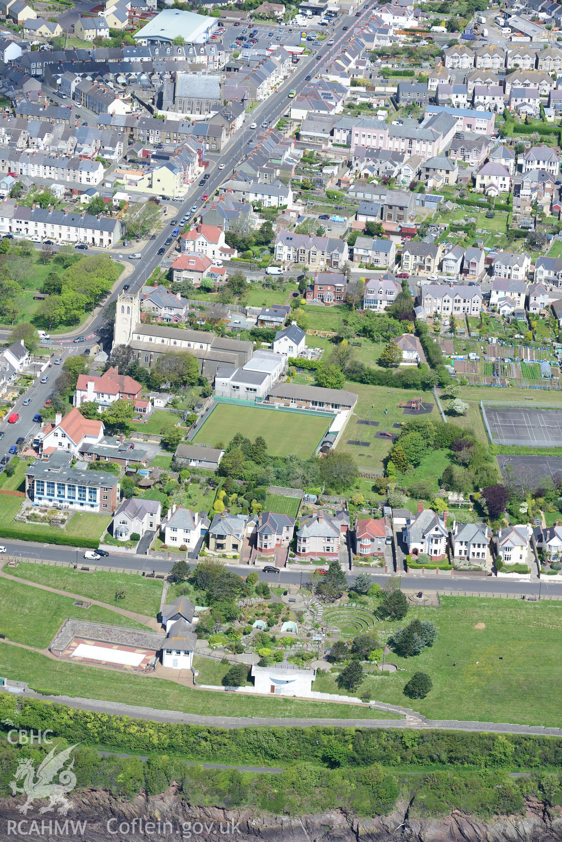 St. Katherine's Church and Pill Public Garden, Milford Haven, Pembrokeshire. Oblique aerial photograph taken during the Royal Commission's programme of archaeological aerial reconnaissance by Toby Driver on 13th May 2015.