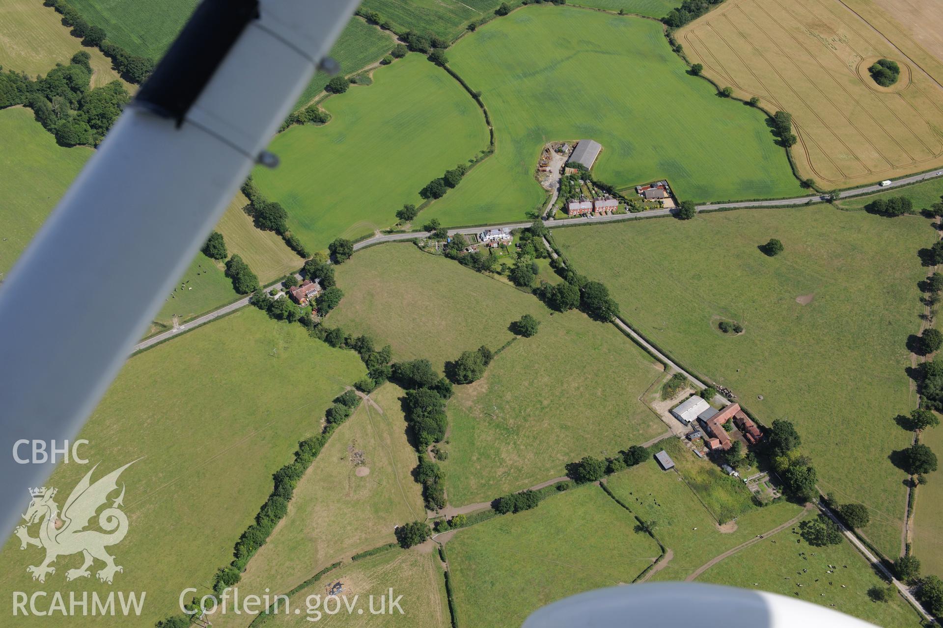 Section of Wat's Dyke extending from Middle Sontley to Black Brook Bridge. Oblique aerial photograph taken during the Royal Commission's programme of archaeological aerial reconnaissance by Toby Driver on 30th July 2015.