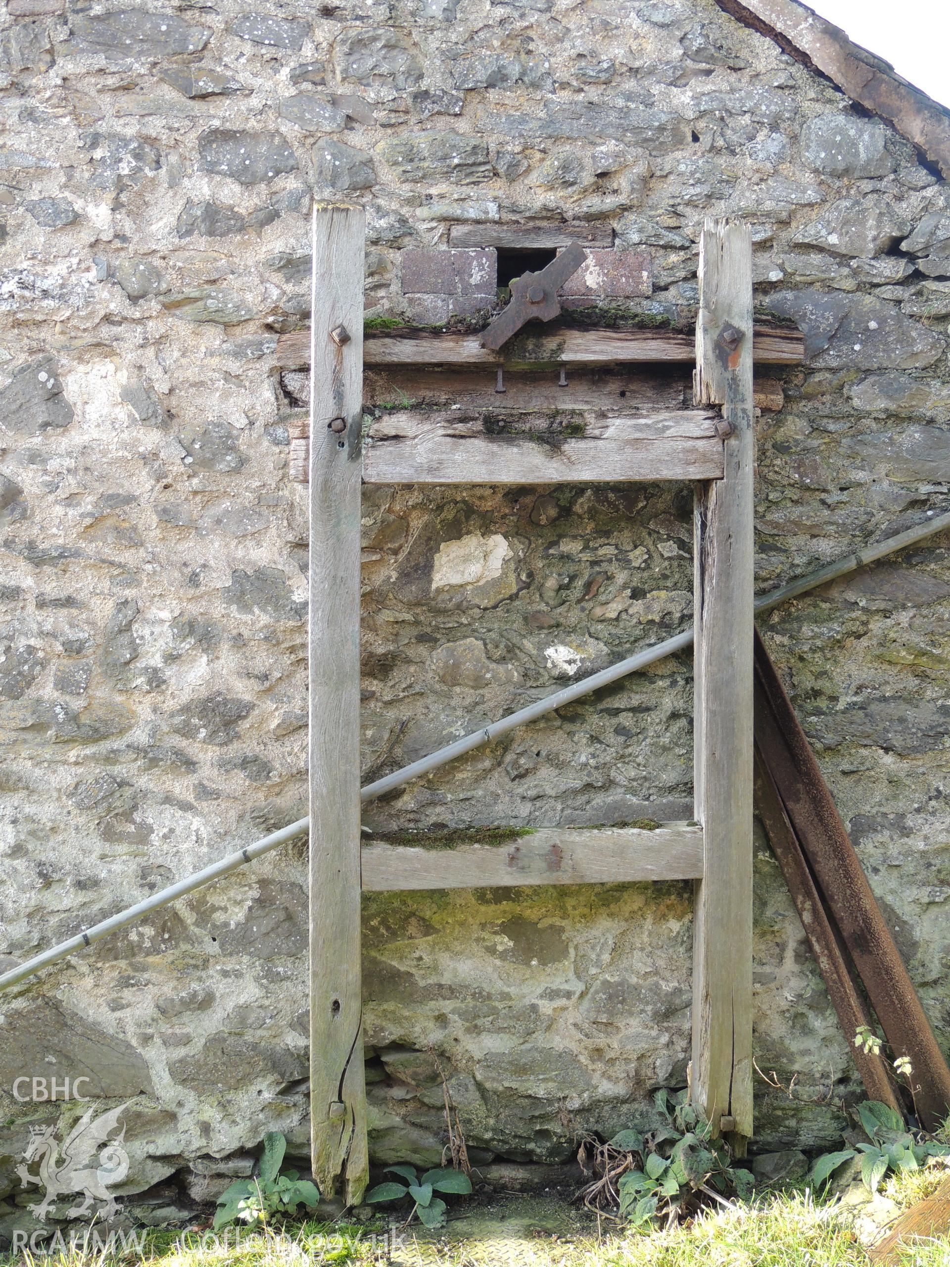 Detail of threshing machine structure attached to eastern elevation. Photograph taken for archaeological building survey at Bryn Gwylan Threshing Barn, Llangernyw, Conwy, carried out by Archaeology Wales, 2017-2018. Report no. 1640. Project no. 2578.