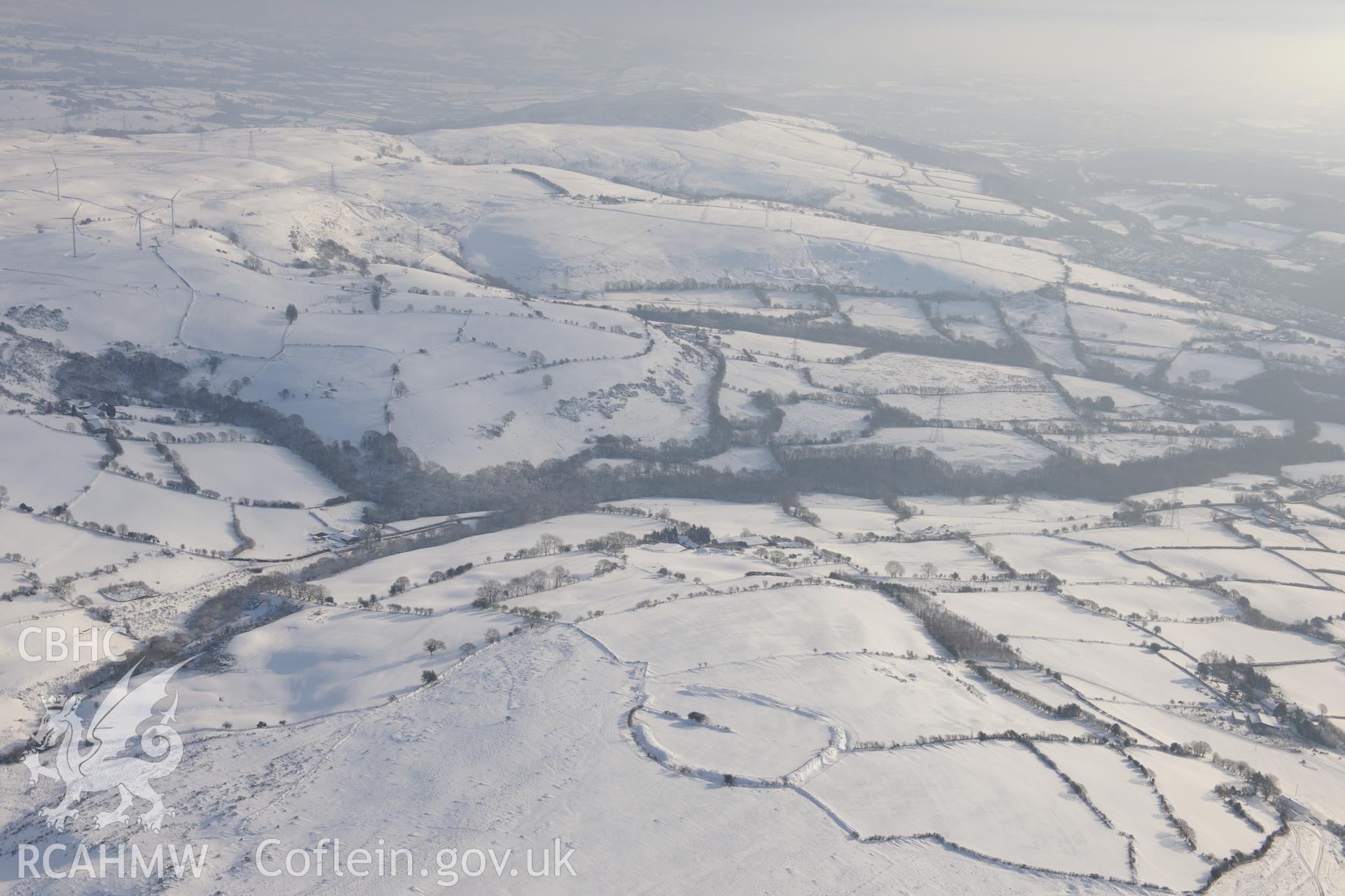 Coedcae Gaer hillfort, north east of Bridgend. Oblique aerial photograph taken during the Royal Commission?s programme of archaeological aerial reconnaissance by Toby Driver on 24th January 2013.