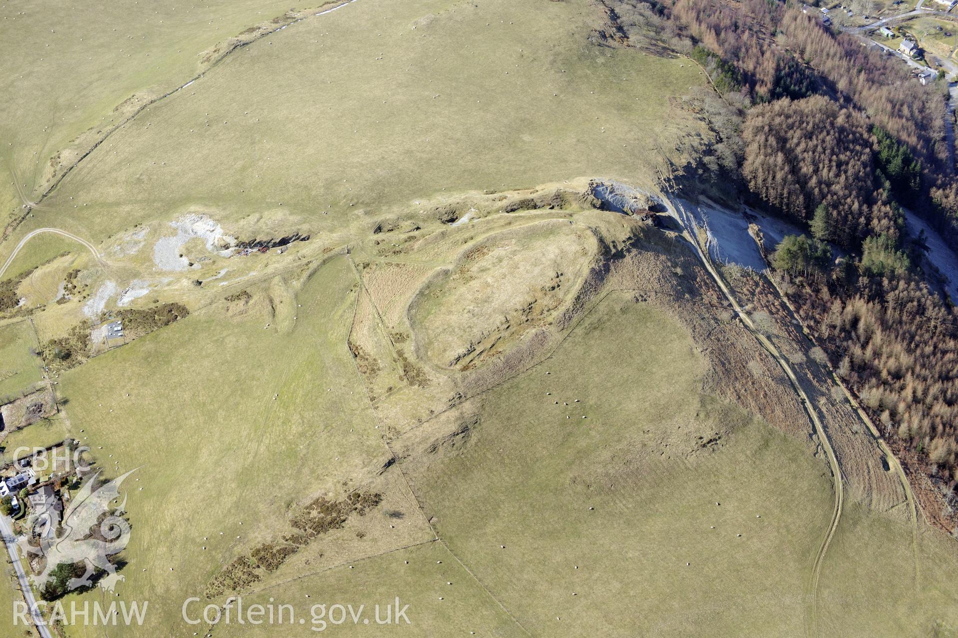 Darren camp hillfort and Cwmsebon mine, east of Aberystwyth. Oblique aerial photograph taken during the Royal Commission?s programme of archaeological aerial reconnaissance by Toby Driver on 2nd April 2015.