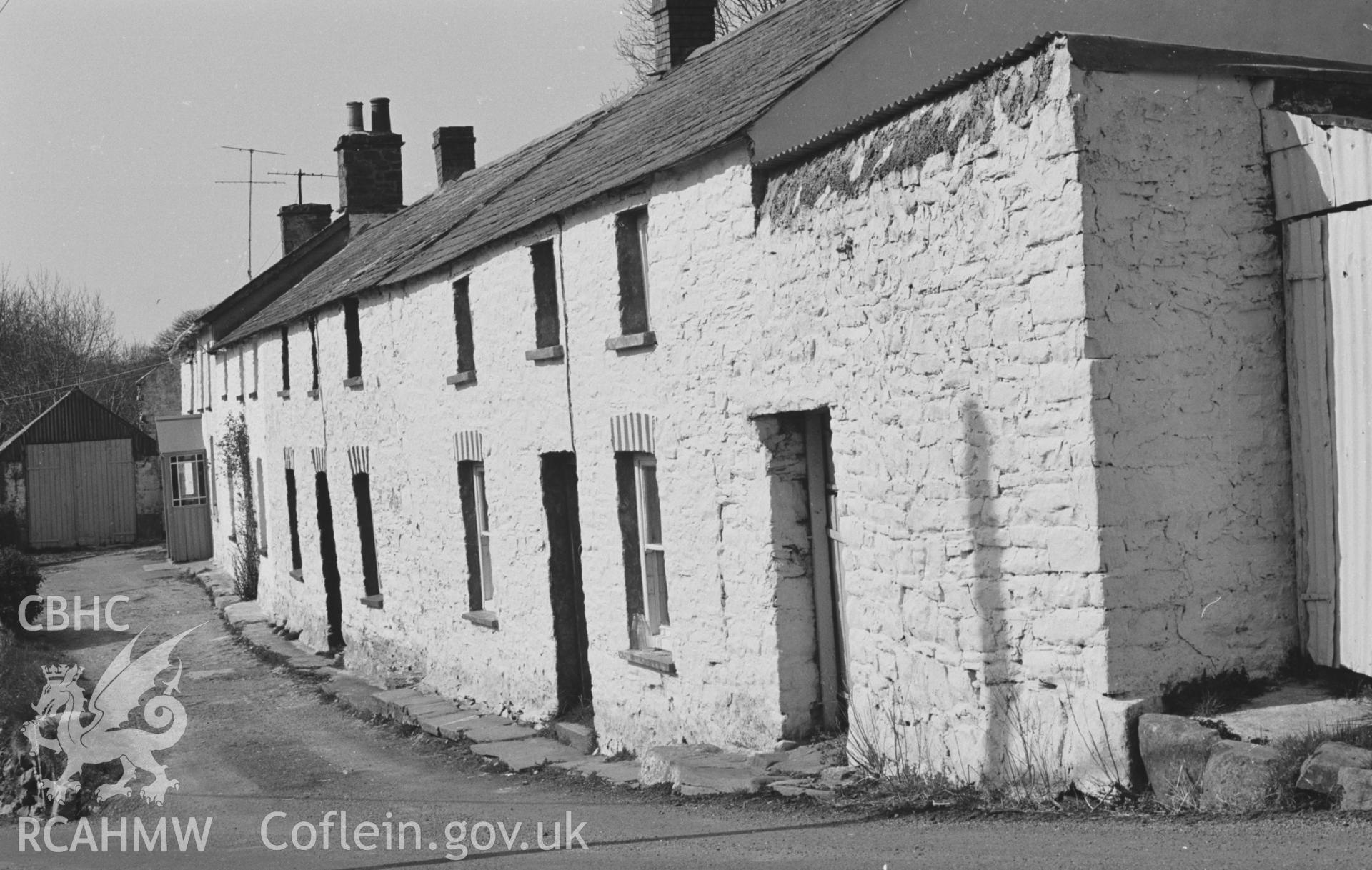 Digital copy of a black and white negative showing terrace of cottages in Penbontrhydyfoethau. Photographed by Arthur O. Chater in April 1968. (Looking north west from Grid Reference SN 359 547).