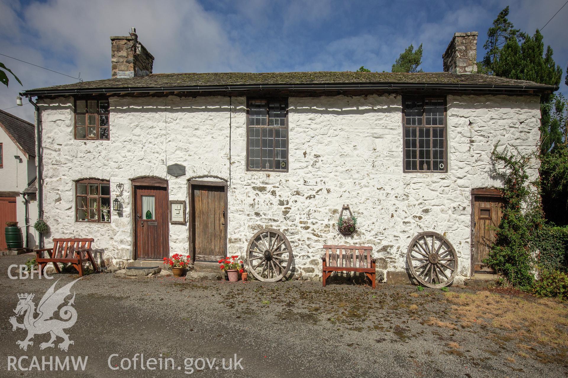 Colour photograph showing side elevation and entrance of John Hughes Memorial Calvinistic Methodist Chapel, Pontrobert. Photographed by Richard Barrett on 9th September 2018.