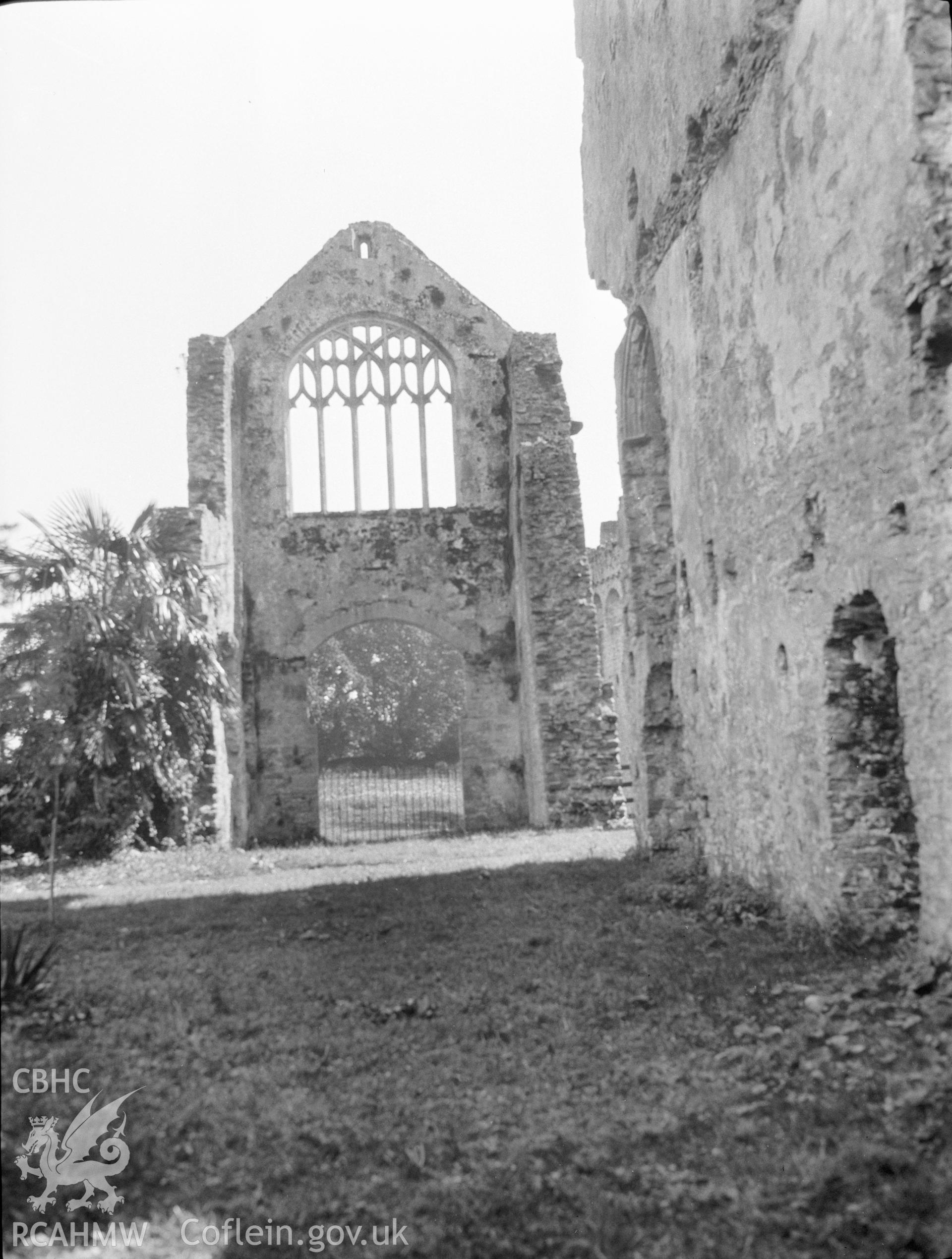 Digital copy of a nitrate negative showing interior view of Lamphey Bishop's Palace, looking towards the remains of the east window. From the National Building Record Postcard Collection.