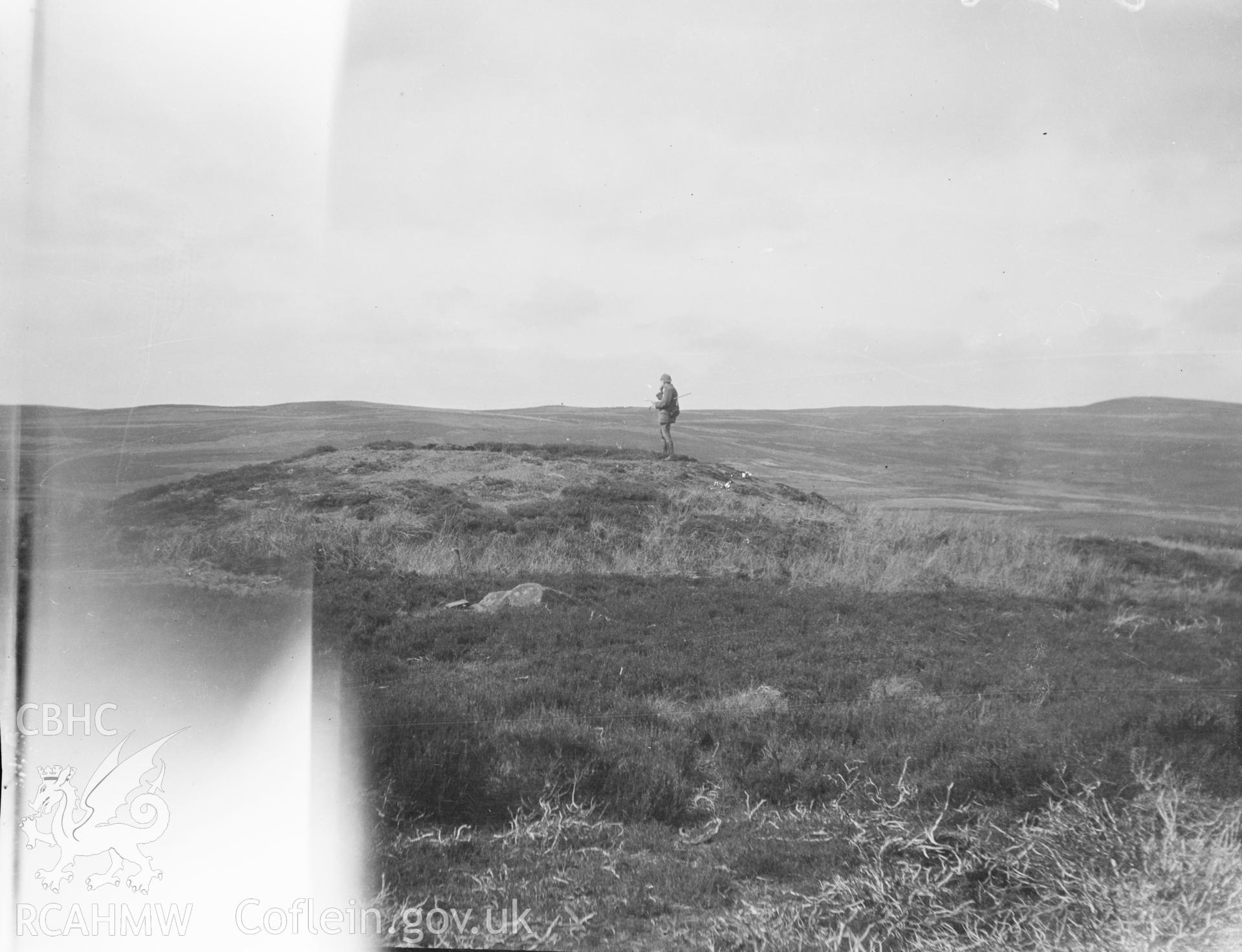 Digital copy of a nitrate negative showing Boncyn Arian Round Barrows. Handwritten note on reverse of black and white photograph: 'Brynarian (?) tumulus / Denbigh 475. From the Cadw Monuments in Care Collection.