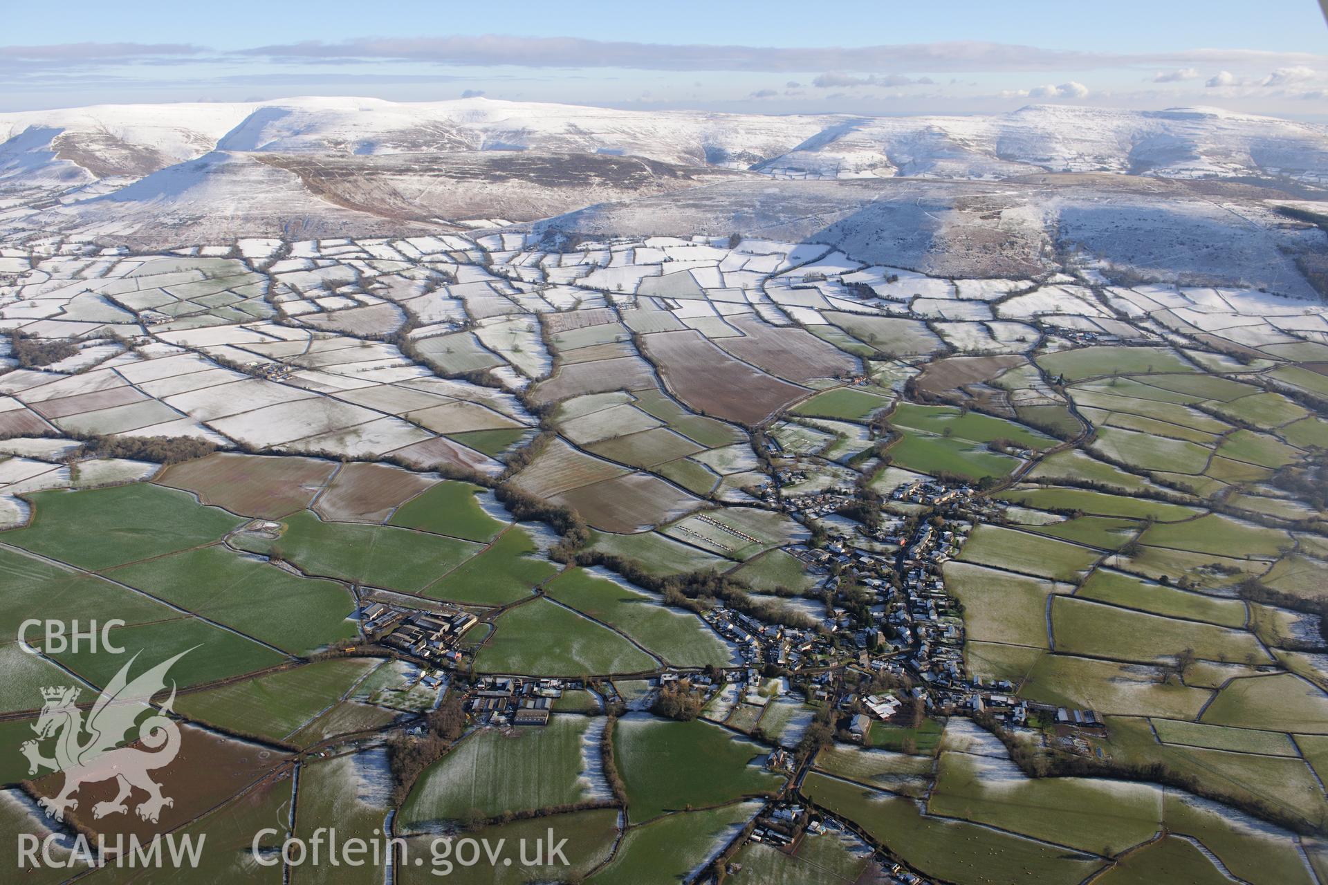 The village of Llangors, east of Brecon. Oblique aerial photograph taken during the Royal Commission?s programme of archaeological aerial reconnaissance by Toby Driver on 15th January 2013.