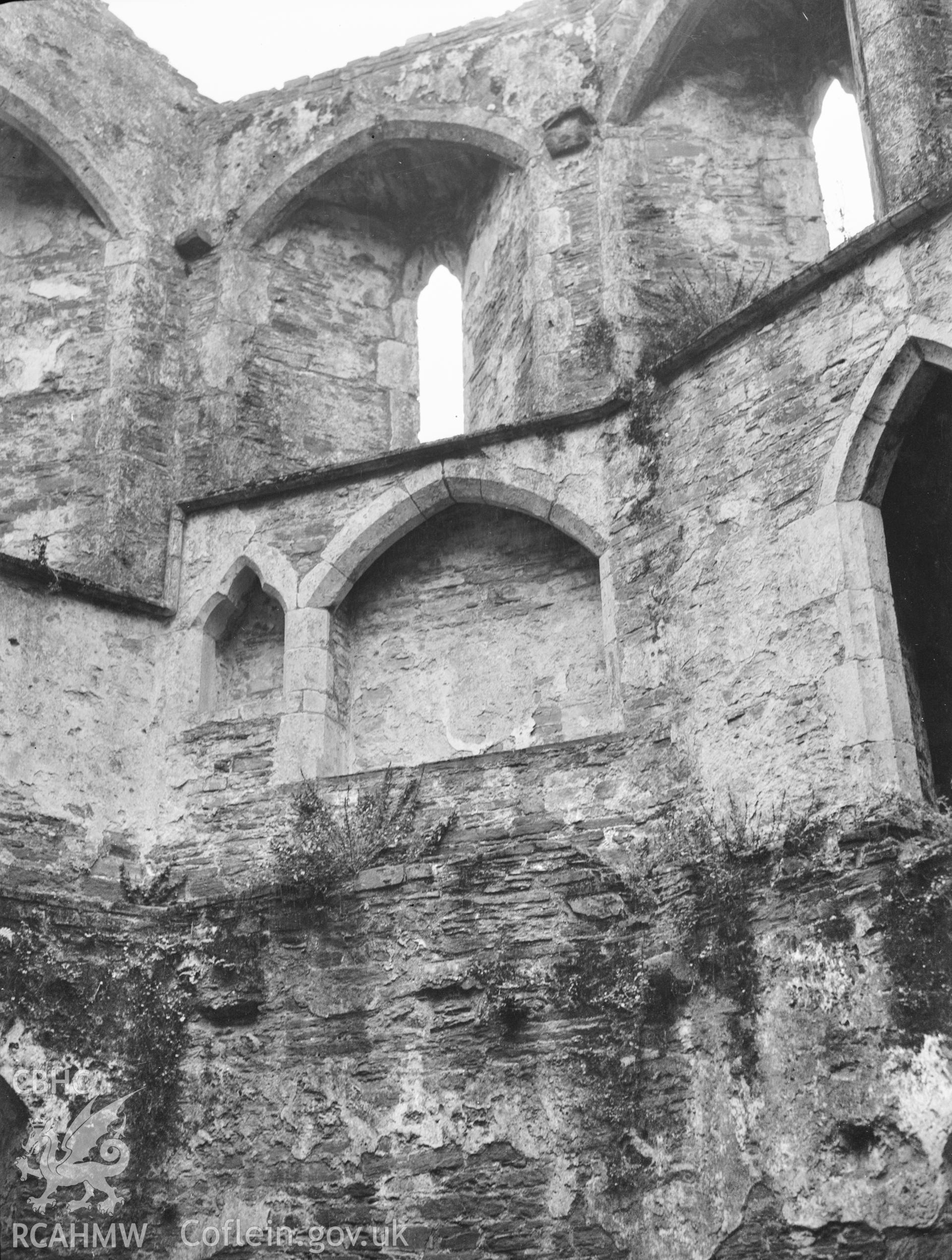 Digital copy of a nitrate negative showing interior walls of chapel, from west, Kidwelly Castle. From the National Building Record Postcard Collection.