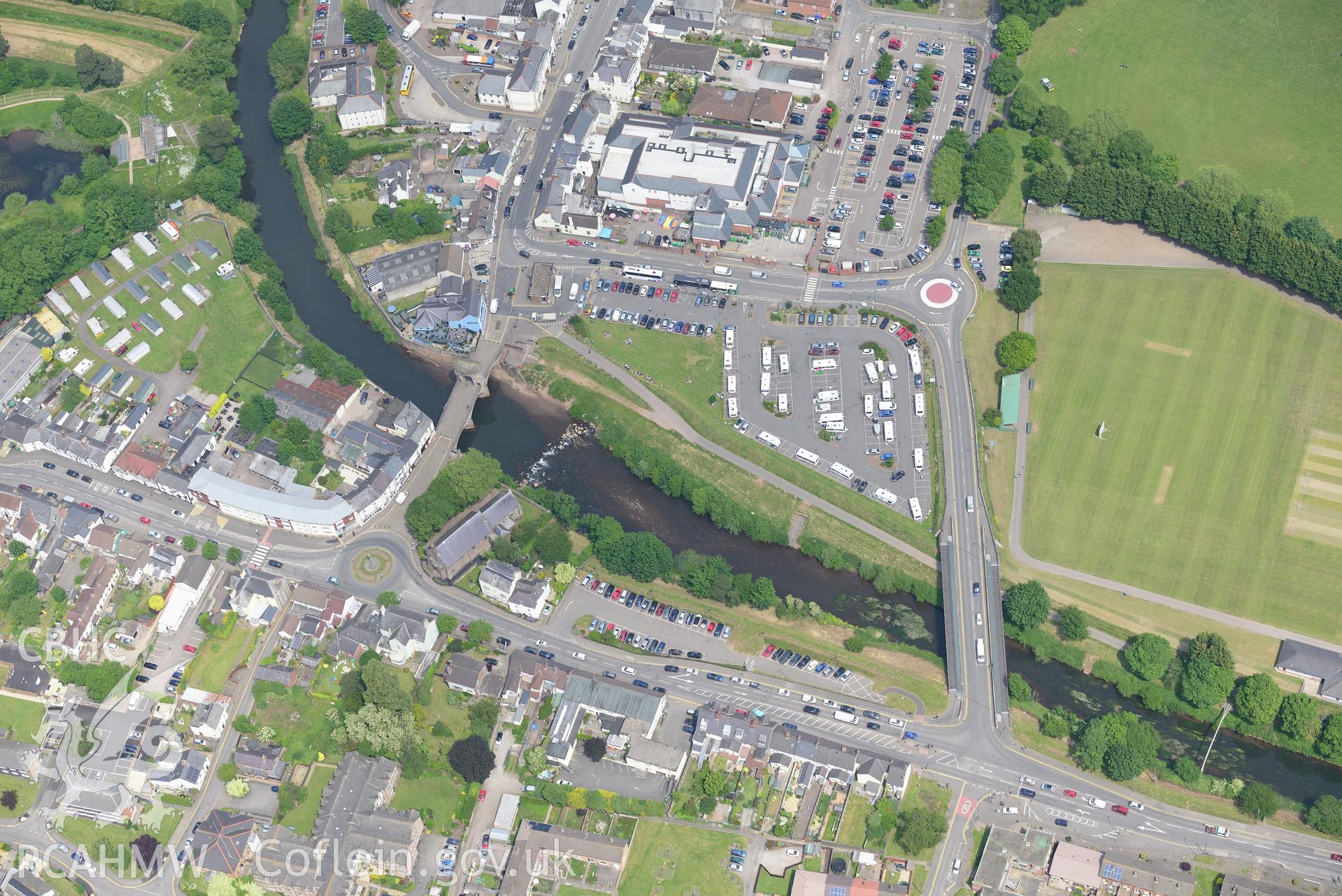 St. Thomas' Church and Monnow bridge and gate, Monmouth. Oblique aerial photograph taken during the Royal Commission's programme of archaeological aerial reconnaissance by Toby Driver on 11th June 2015.