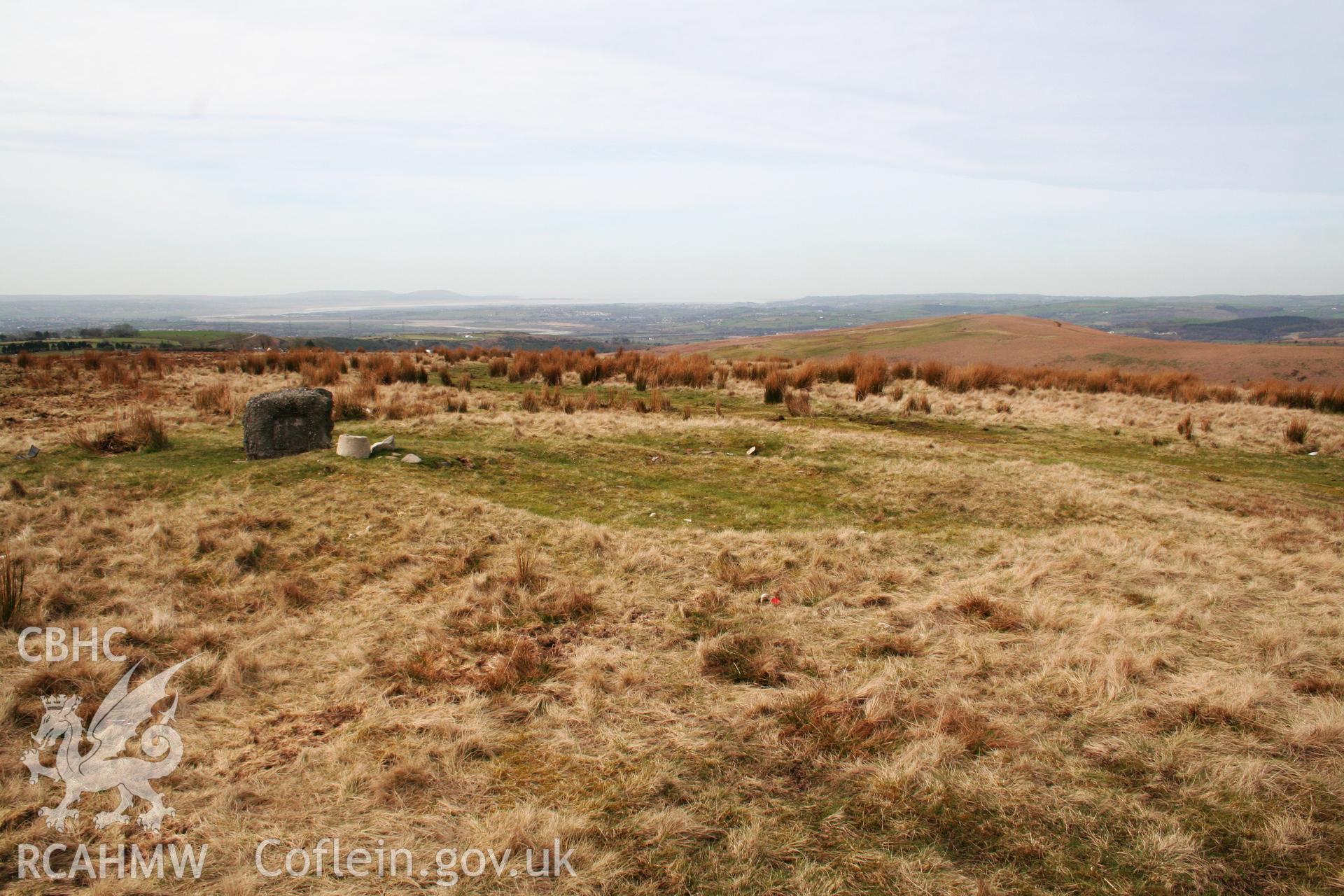 View of cairn looking south-west; fallen trig.point on left of picture.