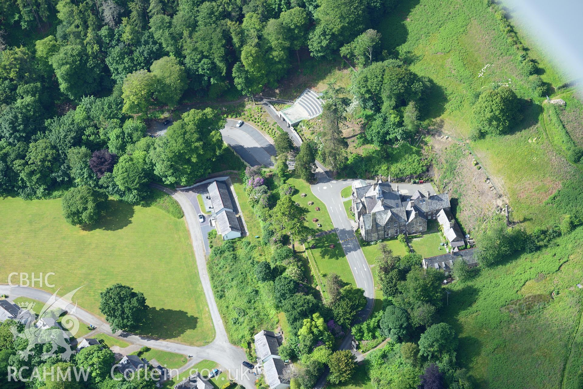 Plas Glyn-y-Weddw including the gardens, outbuildings and stables, Llanbedrog. Oblique aerial photograph taken during the Royal Commission's programme of archaeological aerial reconnaissance by Toby Driver on 23rd June 2015.