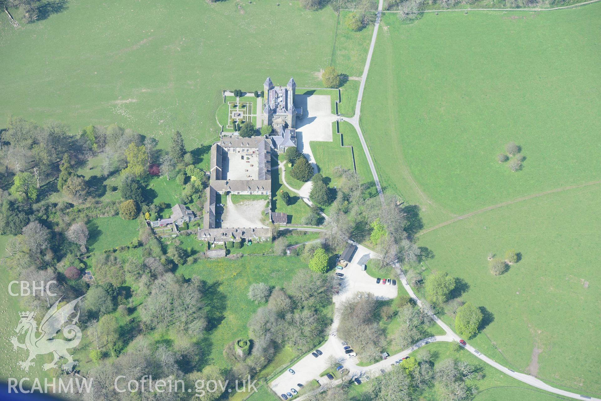 Dinefwr Castle's Newton House, Inner Courtyard, fountain, park, grounds and garden and WW2 Military Camp . Oblique aerial photograph taken during the Royal Commission's programme of archaeological aerial reconnaissance by Toby Driver on 21st April 2015