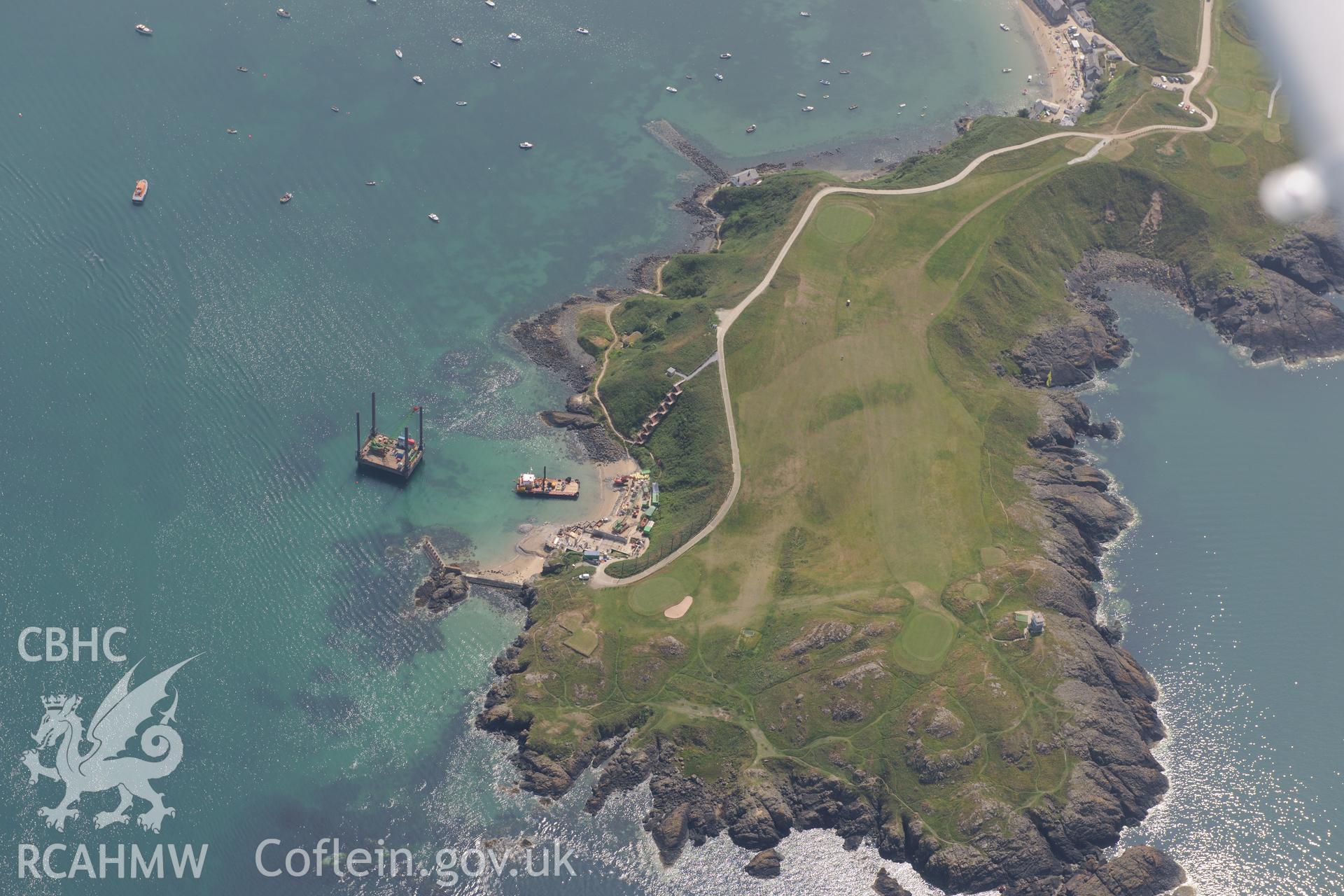 Lifeboat House, Lighthouse, Old Pier, Trwyn Porth Dinllaen Promontory Enclosure and Porth Dinllaen village. Oblique aerial photograph taken during the Royal Commission?s programme of archaeological aerial reconnaissance by Toby Driver on 12th July 2013.