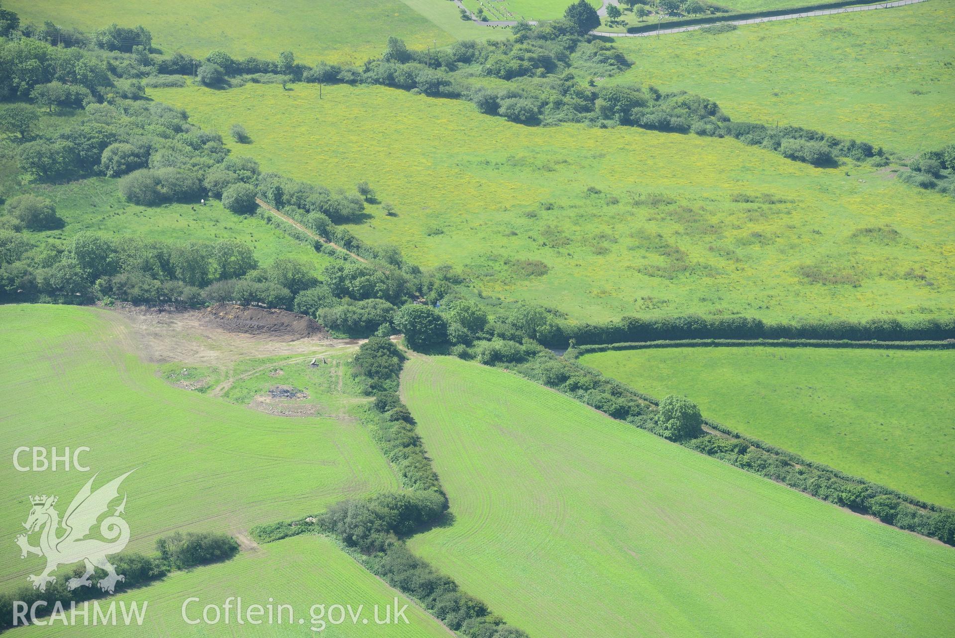 Possible site of St. Cewydd Church, Llangewydd Settlement and the original location of the Laleston Headstone. Oblique aerial photograph taken during the Royal Commission's programme of archaeological aerial reconnaissance by Toby Driver on 19th June 2015.