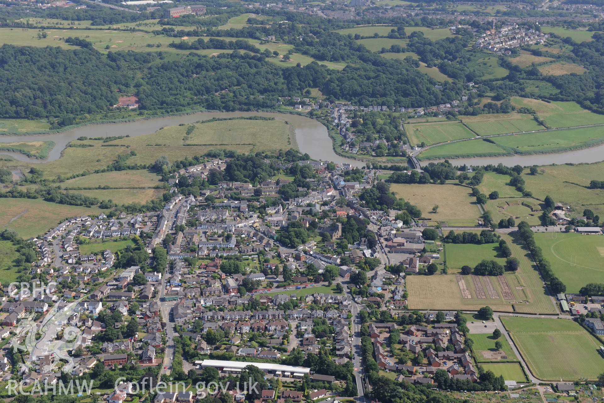 Roman barracks in Prysg Field, Roman parade ground in area under Broadway playing fields, and the town of Caerleon, north east of Newport. Oblique aerial photograph taken during the Royal Commission?s programme of archaeological aerial reconnaissance by Toby Driver on 1st August 2013.