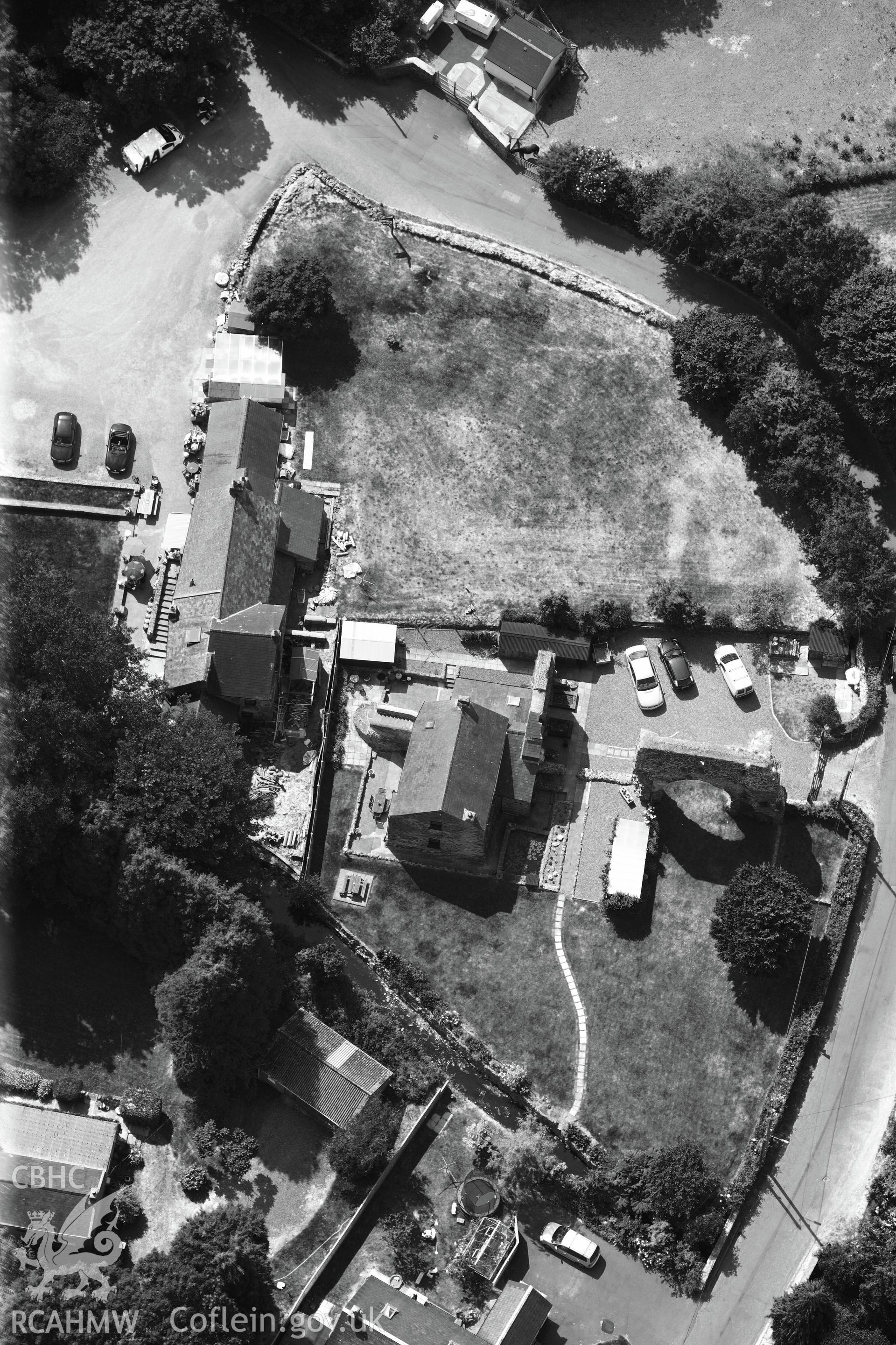 Priory of St Budoc and the Blessed Virgin, and Priory Farm, Milford Haven. Oblique aerial photograph taken during the Royal Commission?s programme of archaeological aerial reconnaissance by Toby Driver on 16th July 2013.