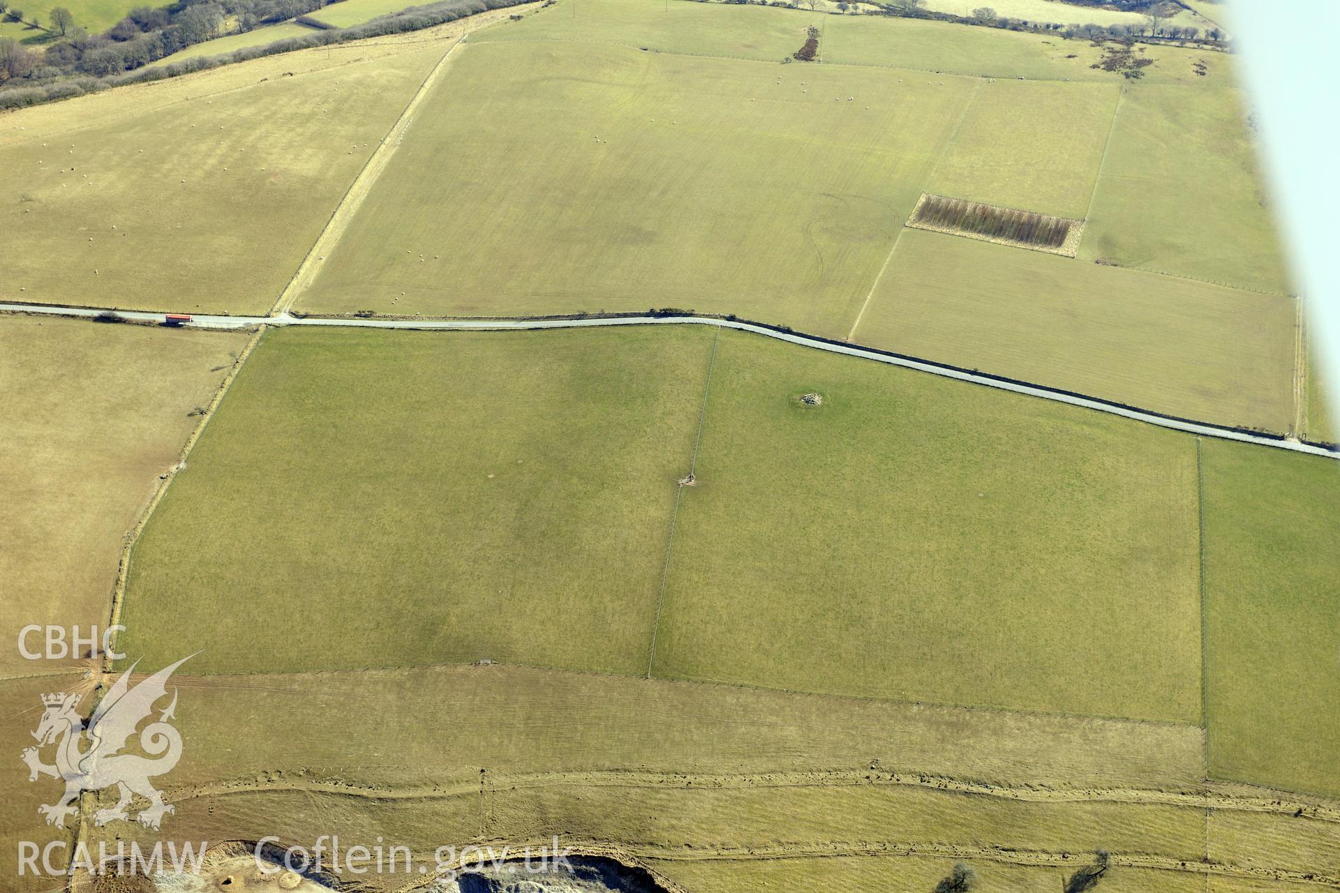 Banc Troed Rhiw Seiri ring barrow, Salem, north east of Aberystwyth. Oblique aerial photograph taken during the Royal Commission's programme of archaeological aerial reconnaissance by Toby Driver on 2nd April 2013.