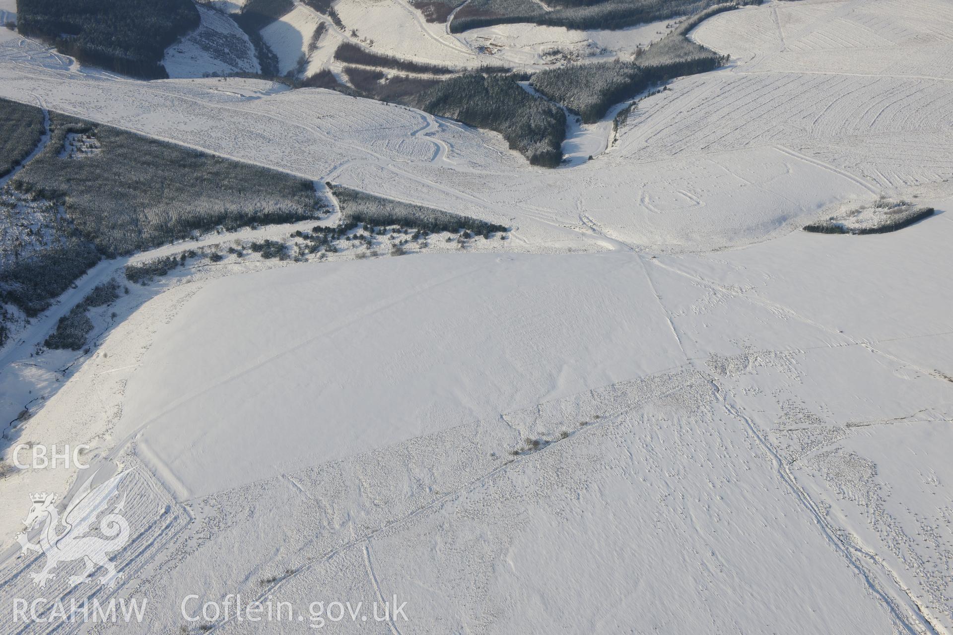 Caer Blaen-y-Cwm defended enclosure, on the edge of Margam Forest, south west of Maesteg. Oblique aerial photograph taken during the Royal Commission?s programme of archaeological aerial reconnaissance by Toby Driver on 24th January 2013.