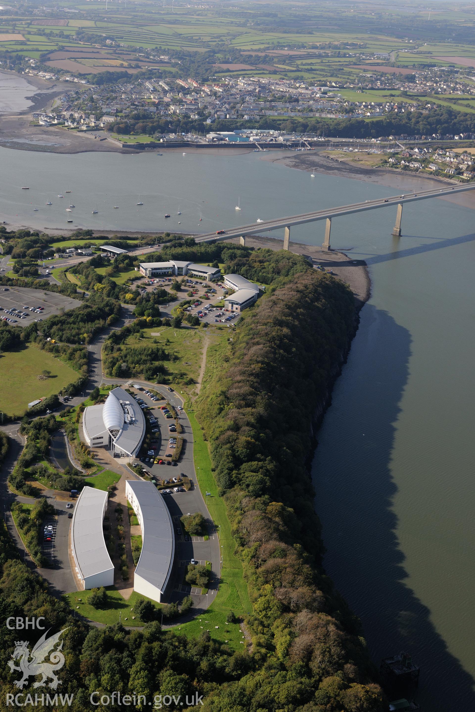 Cleddau Bridge and Cleddau Business Park, Milford Haven. Oblique aerial photograph taken during the Royal Commission's programme of archaeological aerial reconnaissance by Toby Driver on 30th September 2015.