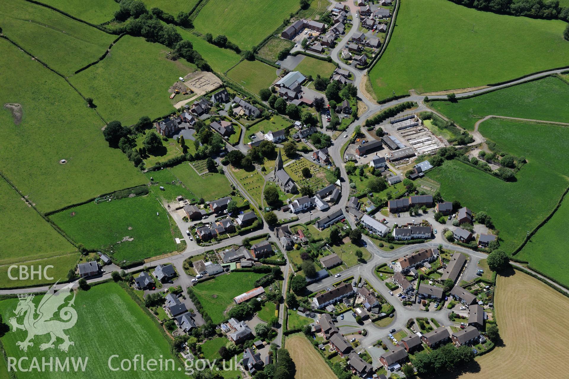 St. Garmon's parish church in the village of Castell Caereinion. Oblique aerial photograph taken during the Royal Commission's programme of archaeological aerial reconnaissance by Toby Driver on 30th June 2015.