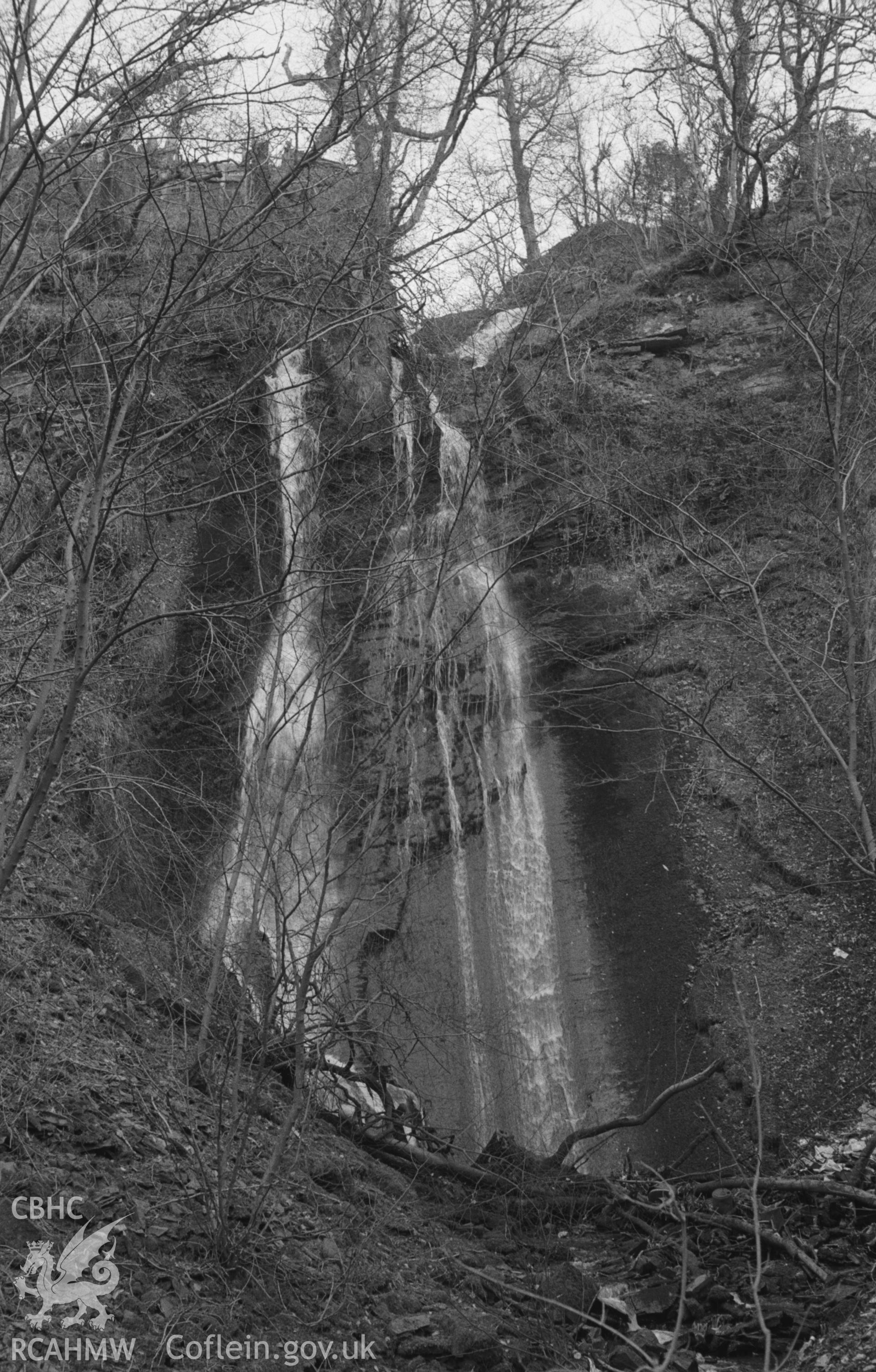 Digital copy of black & white negative showing Caradog Falls near the Railway Halt, Tynygraig, south east of Aberystwyth. Photographed in April 1964 by Arthur O. Chater from the north side of Sychnant at Grid Ref SN 6925 6952, looking east south east.