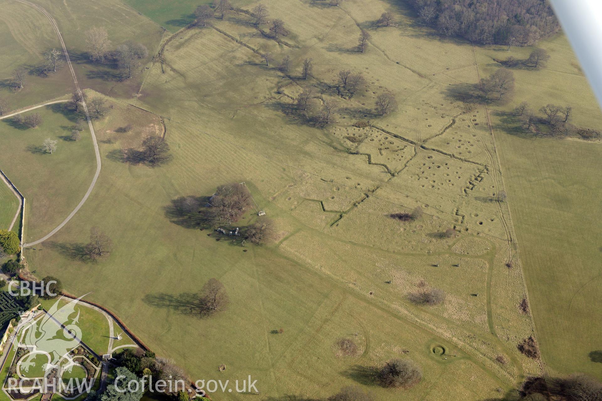 Bodelwyddan Castle garden, and Bodelwyddan Park army practise trenches, west of St. Asaph. Oblique aerial photograph taken during the Royal Commission?s programme of archaeological aerial reconnaissance by Toby Driver on 28th February 2013.