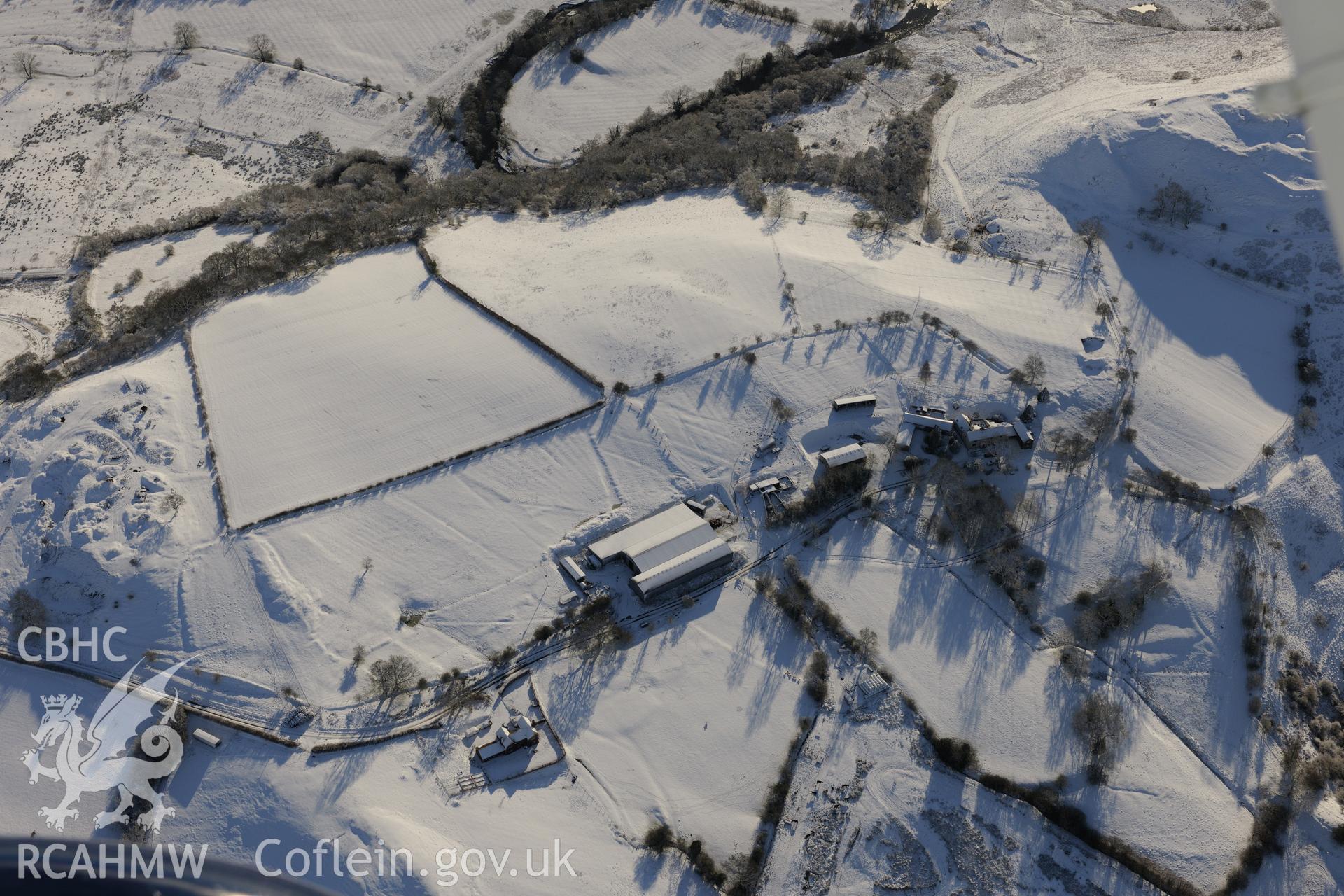 Earthworks of a longhouse and Cefnllys Castle deer park, Penybont, north east of Llandrindod Wells. Oblique aerial photograph taken during the Royal Commission?s programme of archaeological aerial reconnaissance by Toby Driver on 15th January 2013.