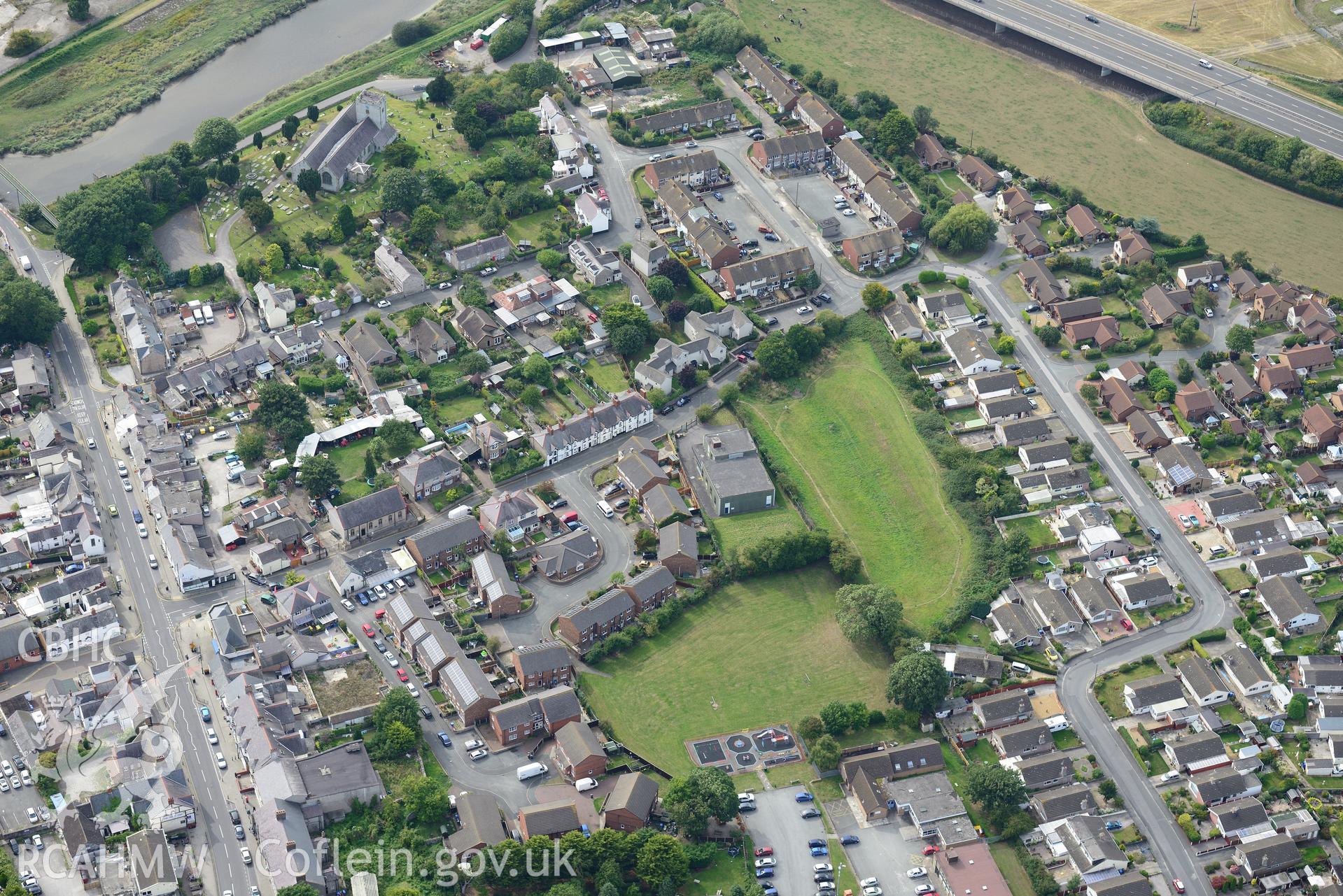 St. Mary's church and Rhuddlan bridge, Rhuddlan. Oblique aerial photograph taken during the Royal Commission's programme of archaeological aerial reconnaissance by Toby Driver on 11th September 2015.