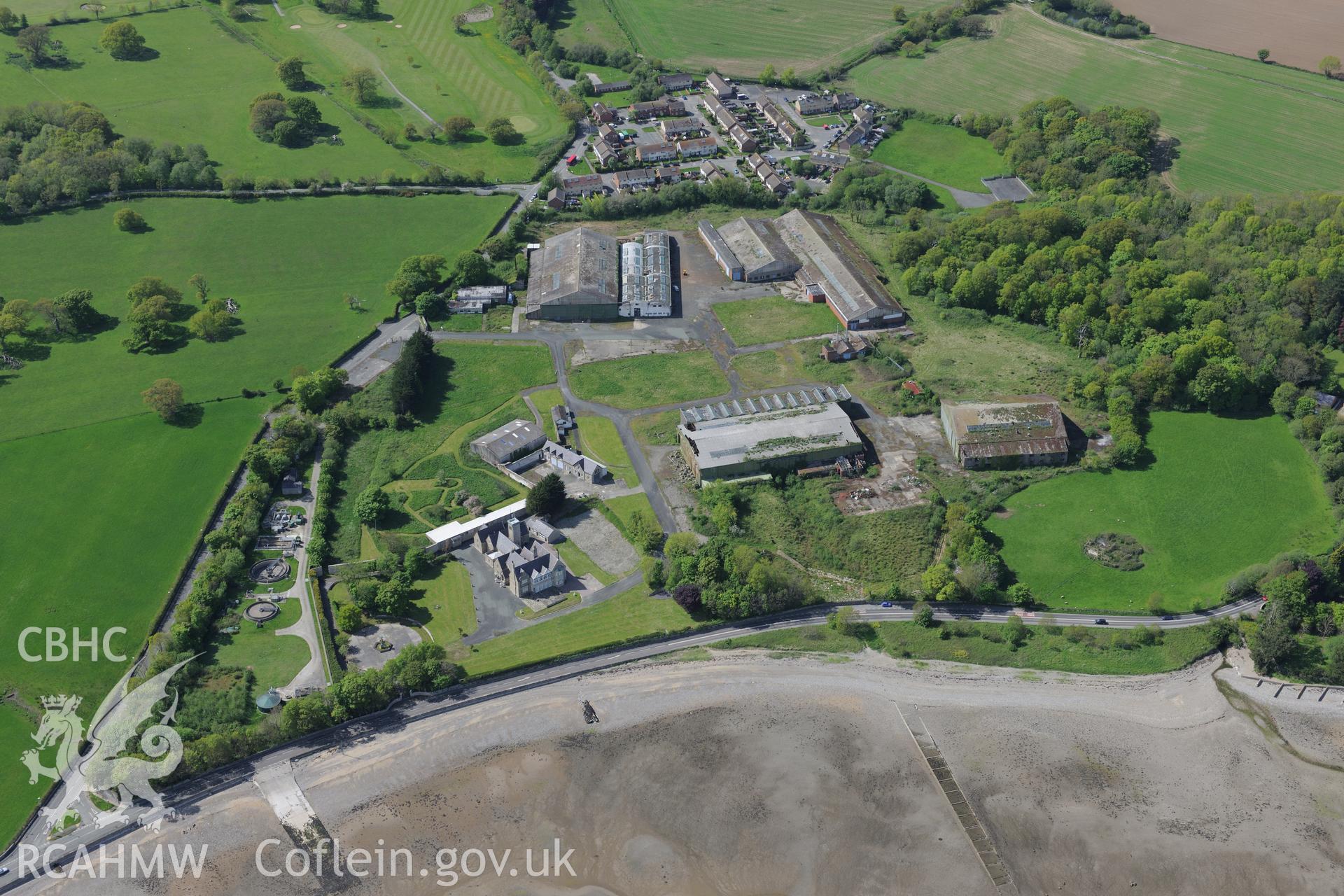 Llanfaes Friary and garden, and Beaumaris Flying Boat Station, Beaumaris. Oblique aerial photograph taken during the Royal Commission?s programme of archaeological aerial reconnaissance by Toby Driver on 22nd May 2013.