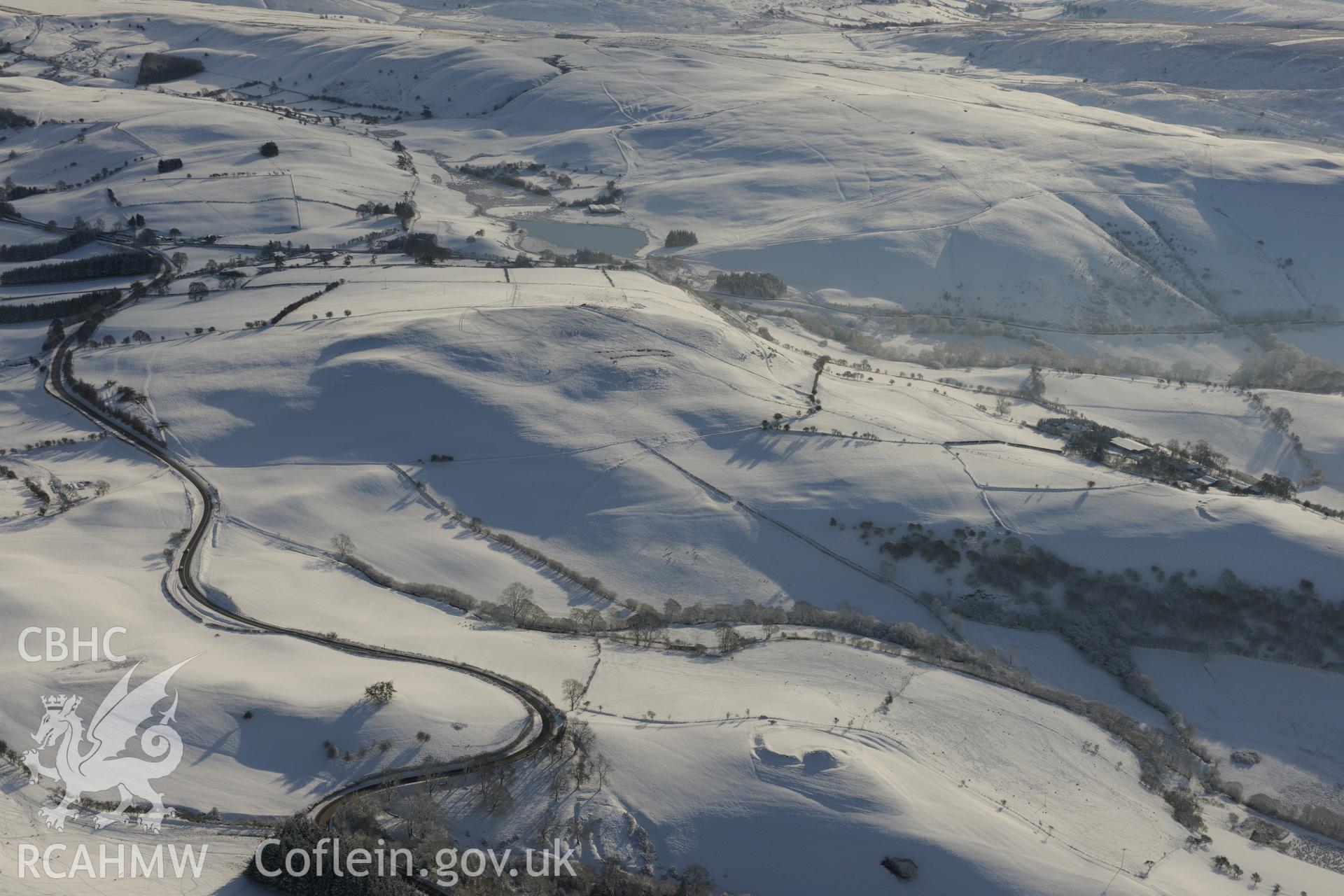 Castell Crugerydd motte and bailey, south east of Llandrindod Wells. Oblique aerial photograph taken during the Royal Commission?s programme of archaeological aerial reconnaissance by Toby Driver on 15th January 2013.