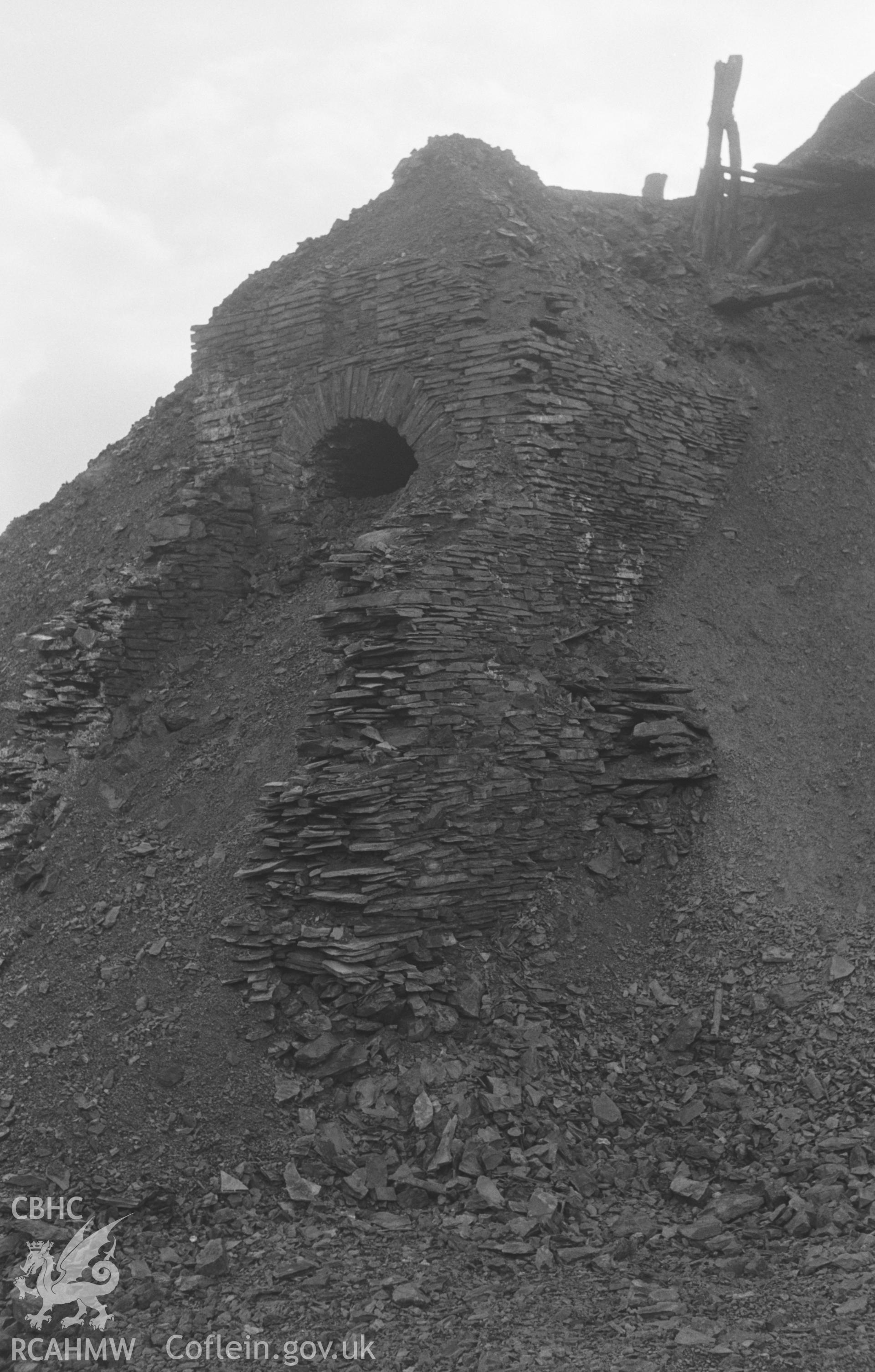 Digital copy of black and white negative showing ruin on west side of Afon Tuen just below the road in the village. Exposed as result of recent removal of part of waste tip. Photograph by Arthur O. Chater, 28 Jan 1968, looking south west from SN 737 788.