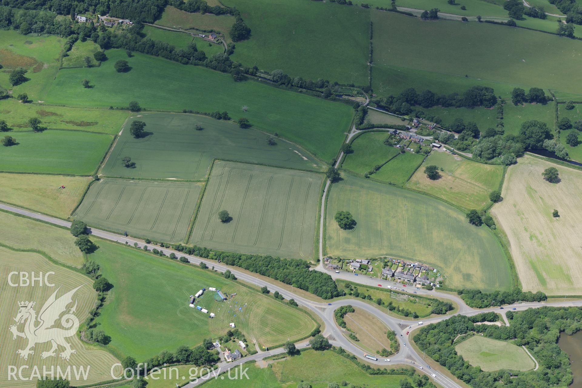 Sarn-y-Bryn Caled nos 1 to 9, and Llwyn-Wron Cursus, south of Welshpool. Oblique aerial photograph taken during the Royal Commission's programme of archaeological aerial reconnaissance by Toby Driver on 30th June 2015.