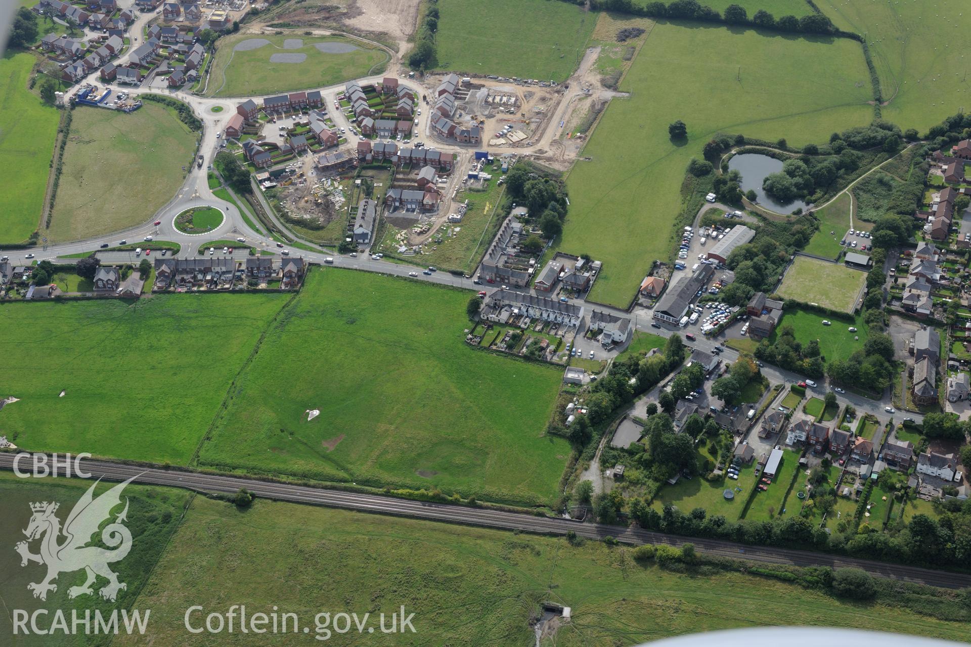 Pentre Bridge Roman settlement and new housing development- Bennet's Row, Flint. Oblique aerial photograph taken during the Royal Commission's programme of archaeological aerial reconnaissance by Toby Driver on 11th September 2015.